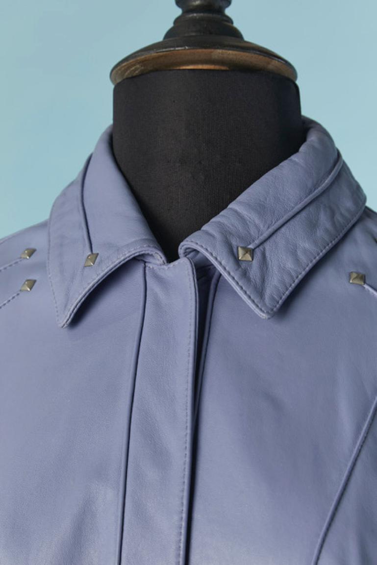 Ice blue leather lamb jacket with top-stitching and metallic studs. Raglan sleeve. Hidden snaps closure in the middle front. 
( button inside the collar to attach a fur collar but we dont have it anymore) 
SIZE M 