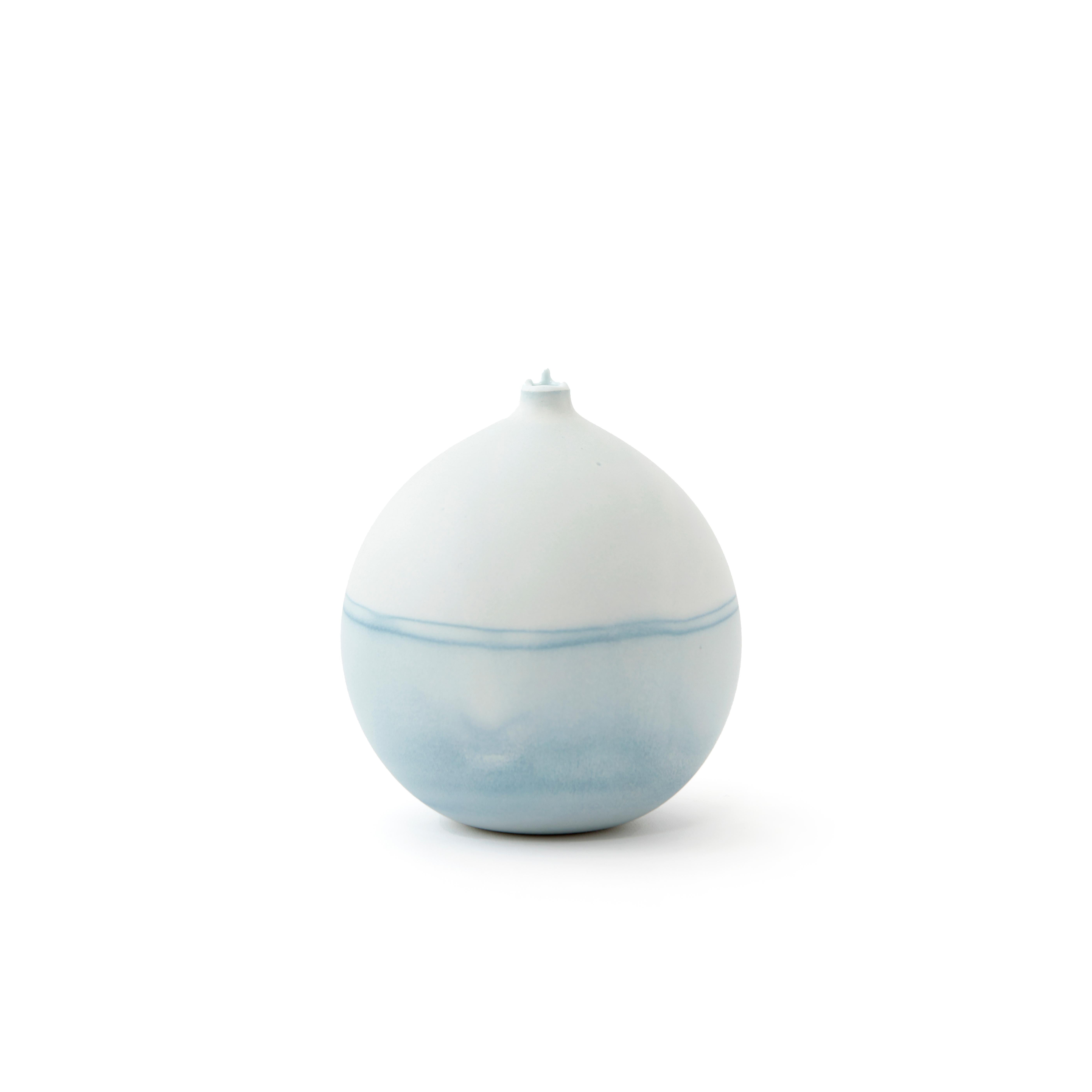 Ice blue pluto vase by Elyse Graham
Dimensions: W 13 x D 13 x H 14 cm
Materials: Plaster, Resin
Molded, dyed, and finished by hand in LA. Customization
available.
All pieces are made to order.

This collection of vessels is inspired by