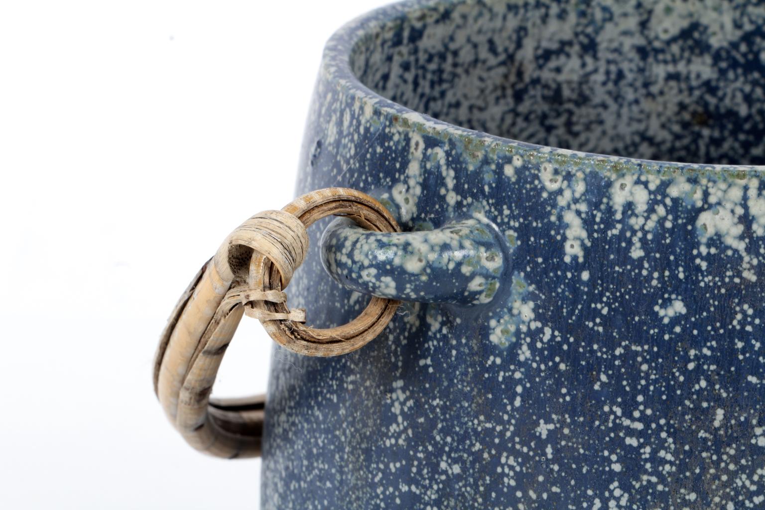 Ice bucket in glazed stoneware of blueish-colored shades with paper cord handles. The bucket is designed by Arne Bang, circa 1940-1960.

    