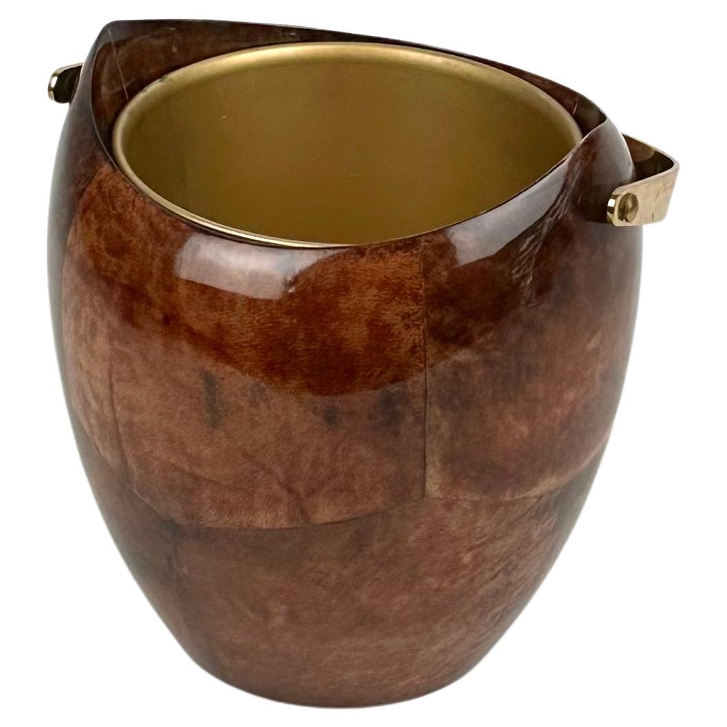 Ice bucket in lacquered brown goatskin and brass by Aldo Tura for Macabo.

Made in Italy in the 1950s.

The original stamp is still visible on the bottom as shown in the pictures.