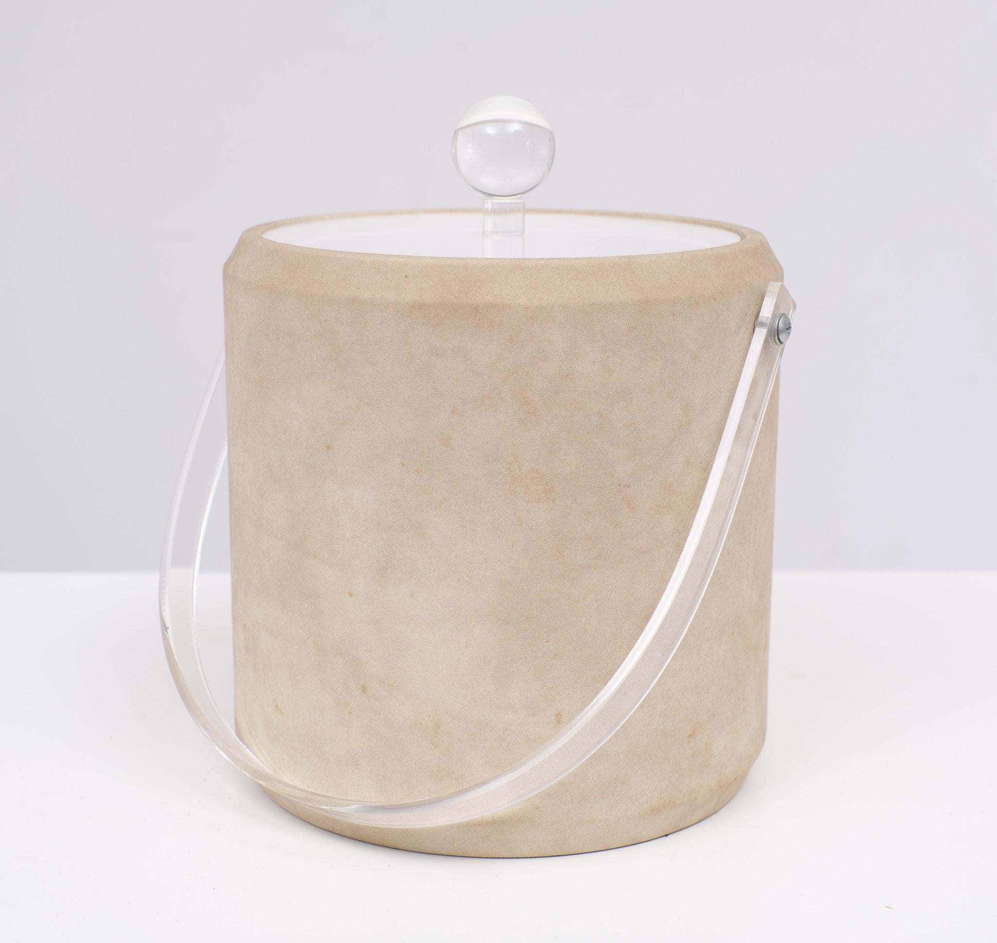 Very nice ice bucket. Looks like stone or Suede. Lucite lid and handle.
Made by the Bucket Brigade USA 1970s.