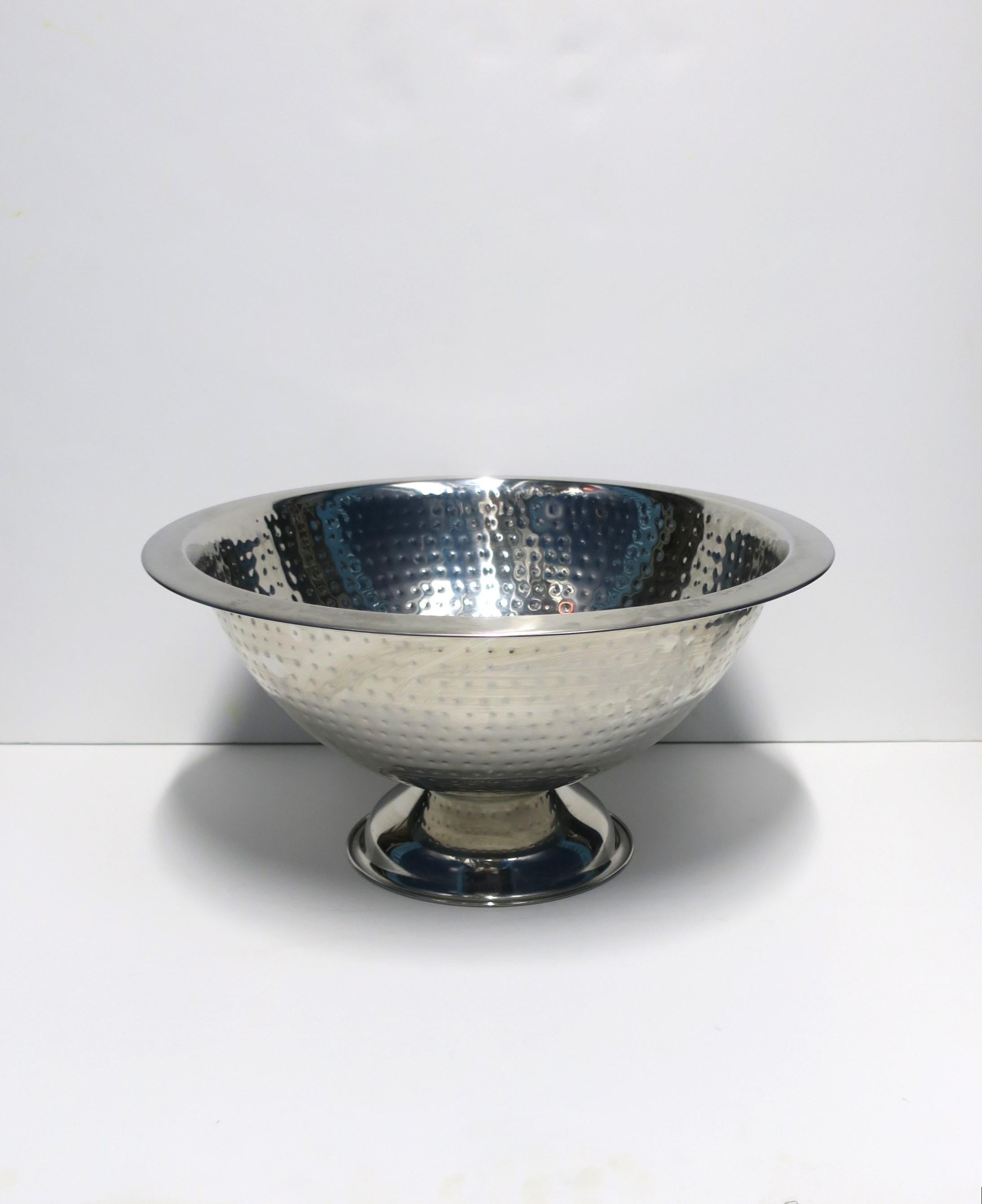A relatively large round metal Champagne wine cooler or ice bucket in an urn form with hammered design, circa 21st century. A great piece for Champagne, wine, water, beer, etc., seafood, etc., a must for keeping beverages or other items cold when