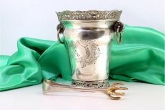 Ice bucket w/ silver tongs, ring handles & cut-out rim reliefs