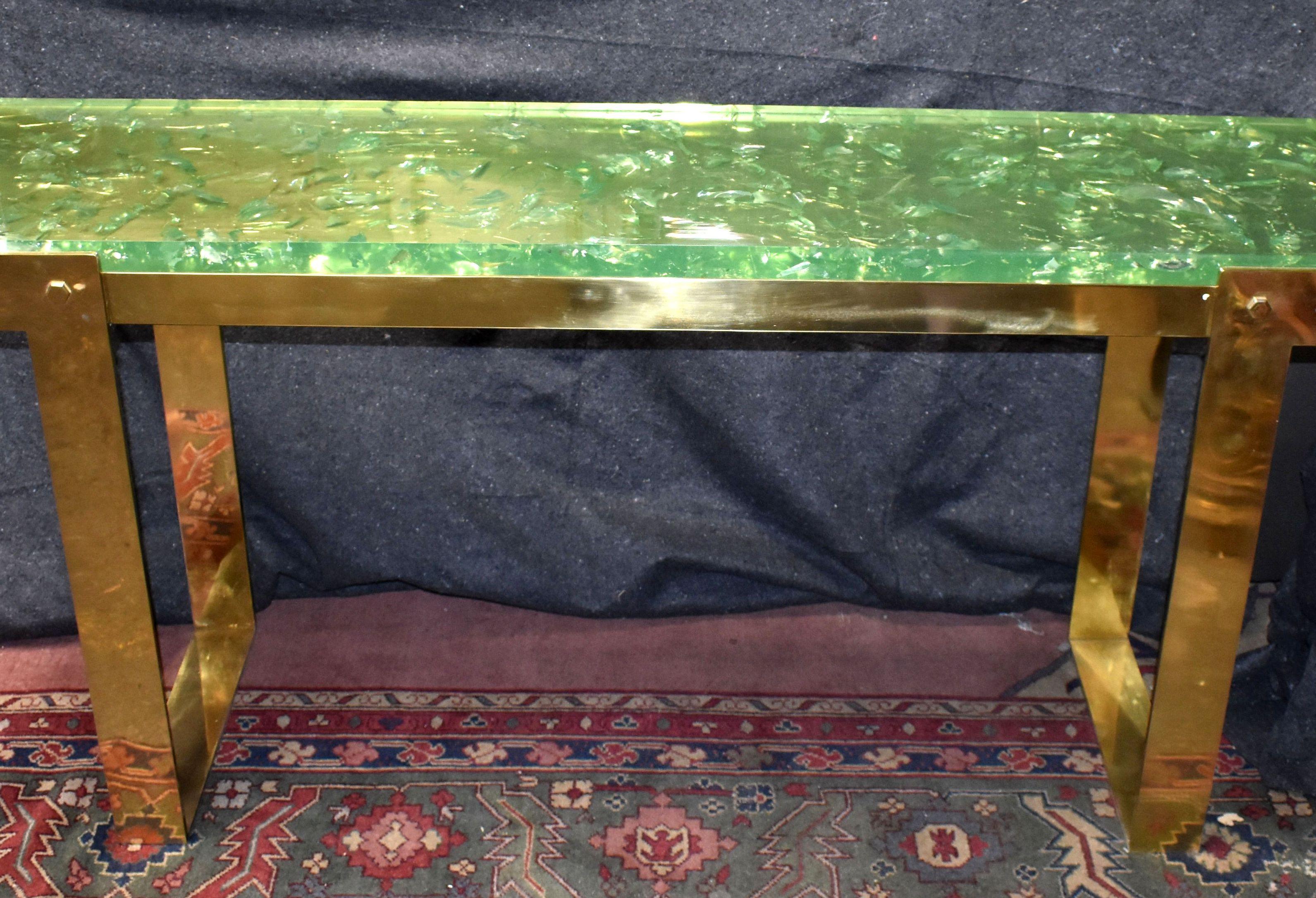 Sculptural thick green ice cracked resin top on solid brass base console table.