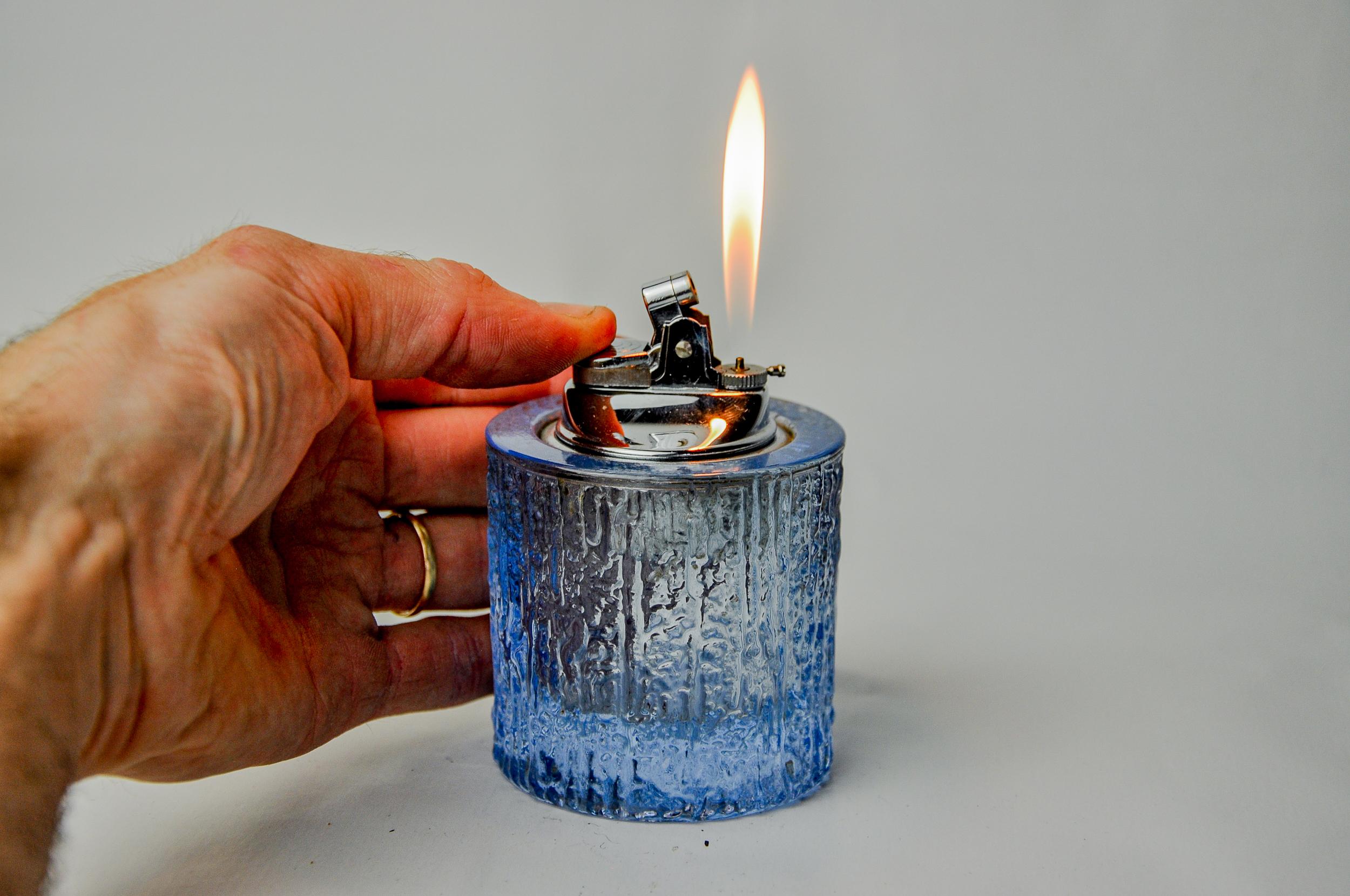 Superb circular ice lighter designed and produced by antonio imperatore in italy in the 1970s. Blue murano glass lighter with a magnifying effect on its facets, handcrafted by venetian master glassmakers. Decorative object that will bring a real