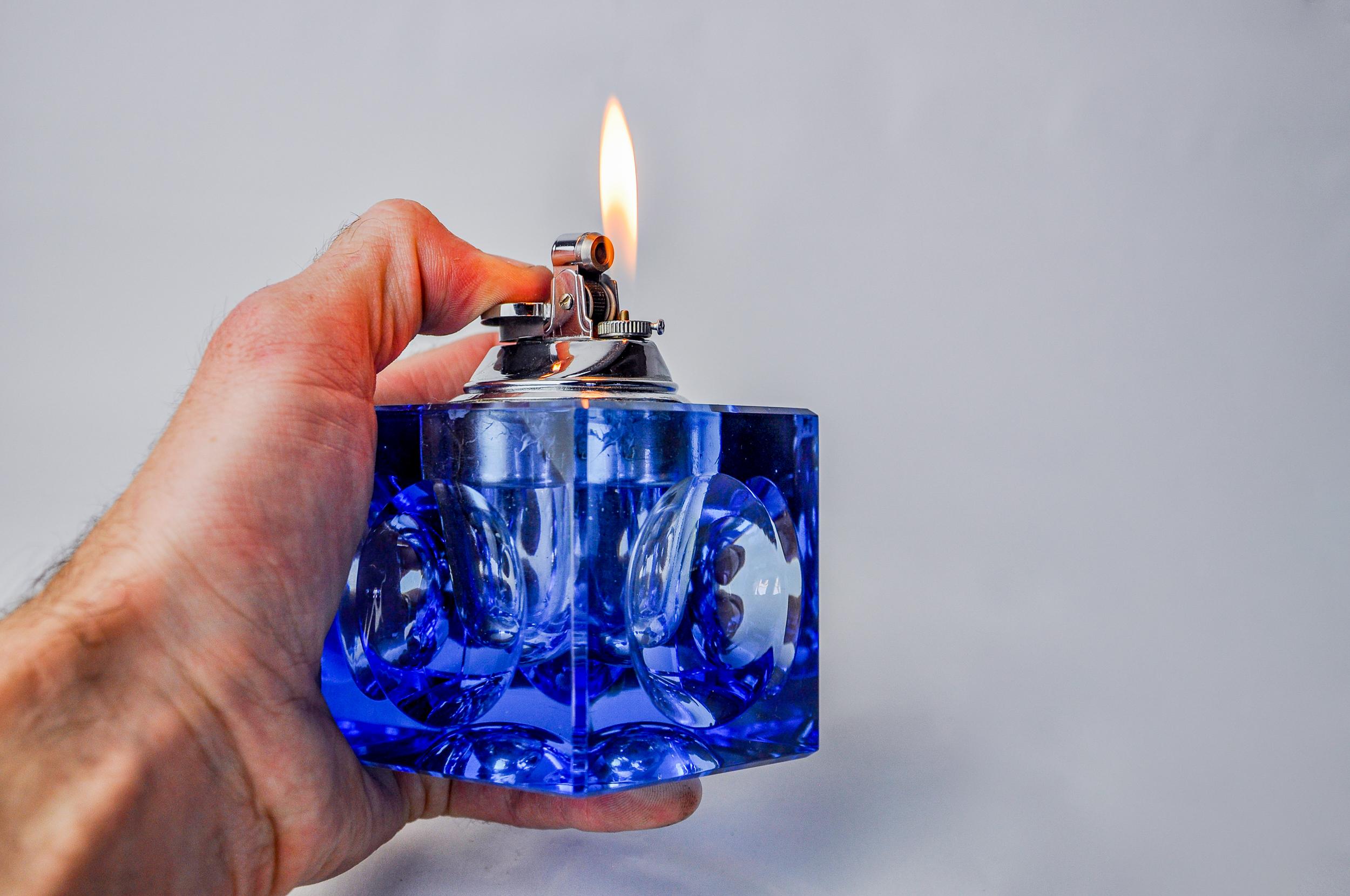 Superb ice lighter designed and produced by antonio imperatore in italy in the 1970s. Blue murano glass lighter with a magnifying effect on its facets, handcrafted by venetian master glassmakers. Decorative object that will bring a real design touch