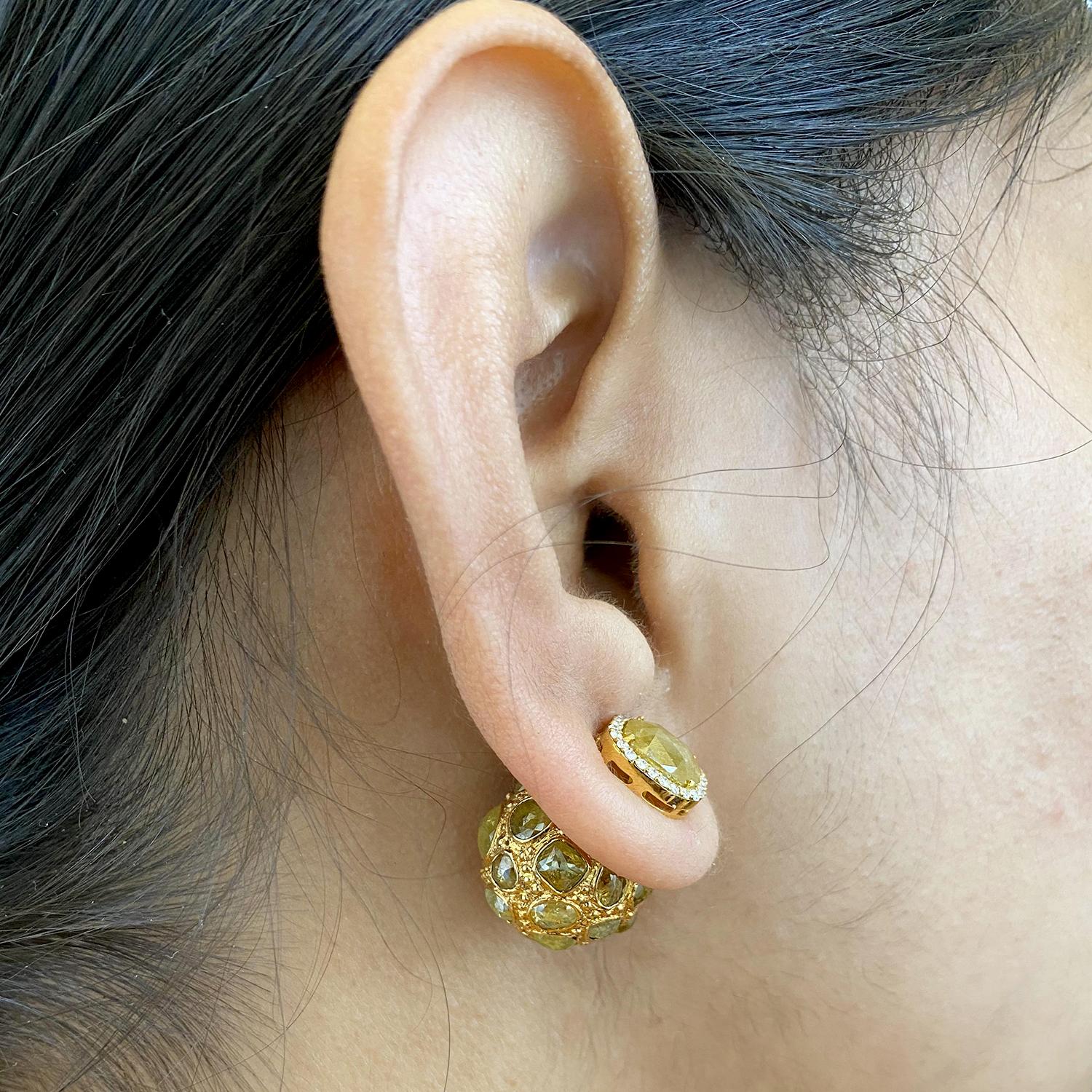 These earrings are made of 18 karat gold and feature diamonds in the form of ice diamond . Ice diamonds are the most popular choices for diamond jewelry. The combination of the gleaming gold and sparkling diamonds gives these earrings a classic and