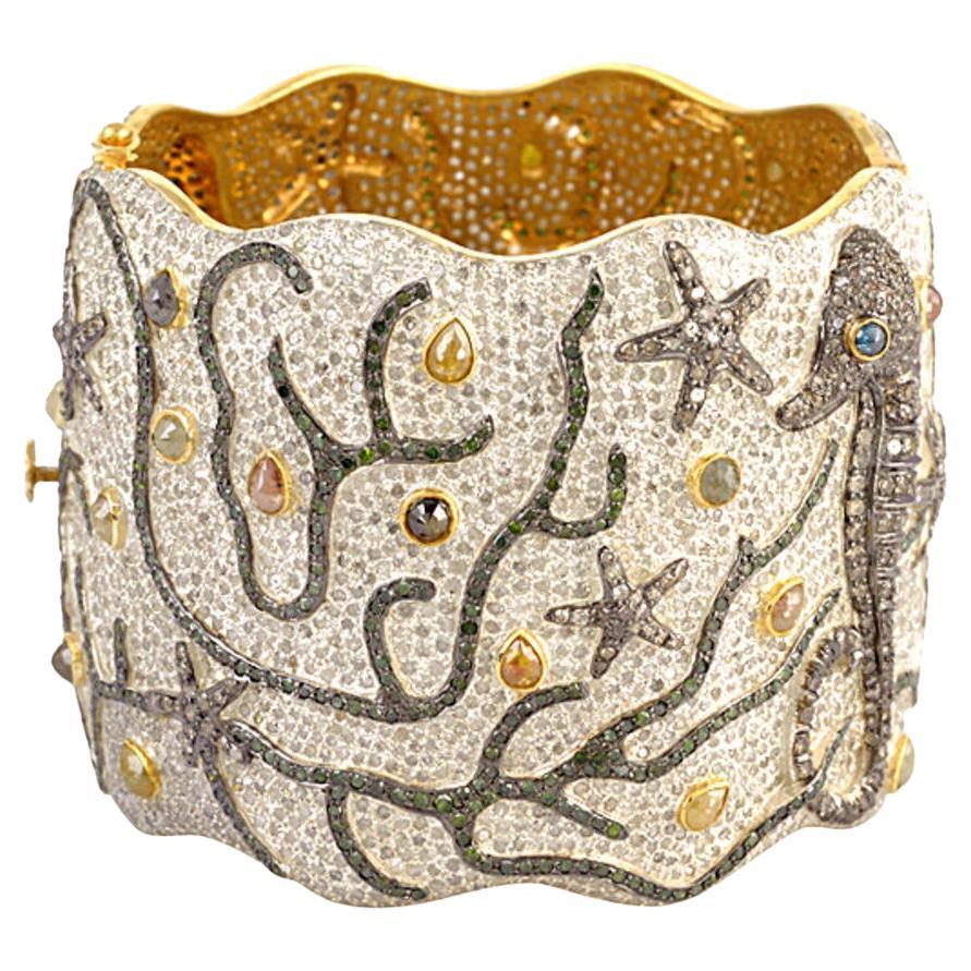 Bracelet manchette en or et argent 18k avec diamants de glace et motifs de vie marine