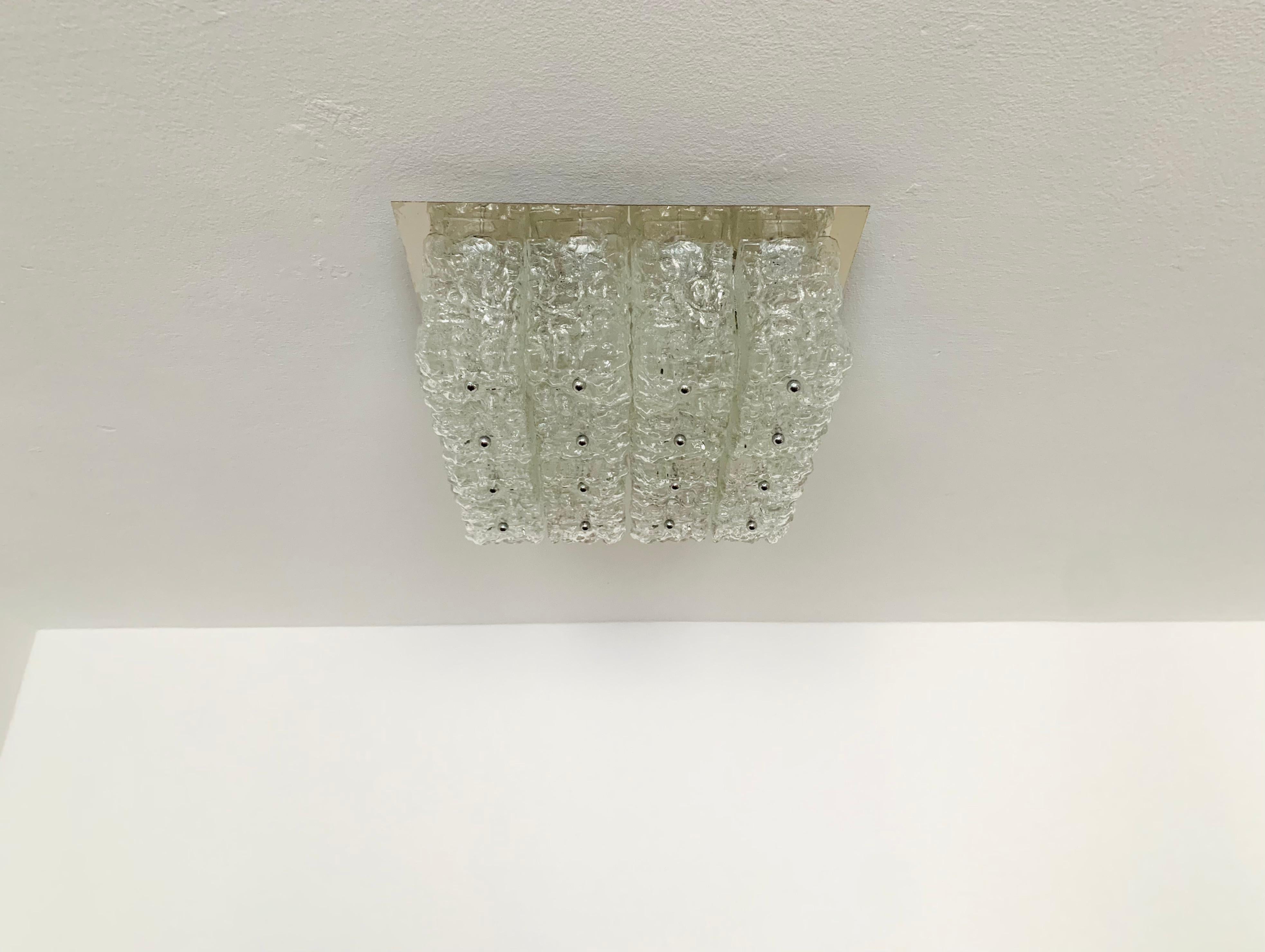 Wonderful and heavy ice glass ceiling lamp from the 1960s.
Fantastic design and high quality workmanship.
The structure in the glass creates a very beautiful sparkling light.

Manufacturer: Manufactory Glashütte Limburg.

Condition:

Very