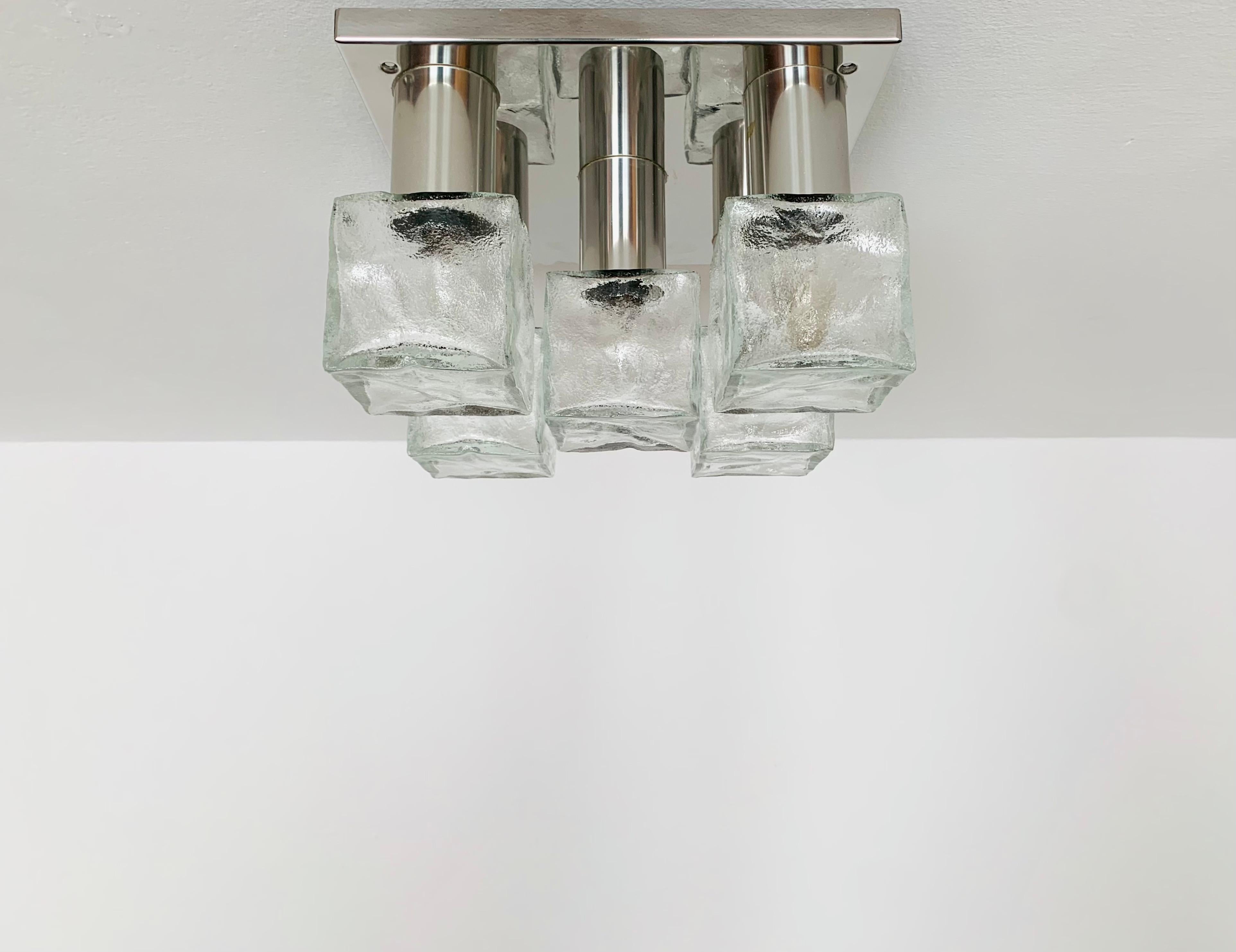 Wonderful ice glass ceiling lamp from the 1960s.
The beautifully formed Murano glass elements create an impressive, sparkling play of light.
Very high-quality workmanship and a real eye-catcher for every home.

Design: J.T. Kalmar
Manufacturer:
