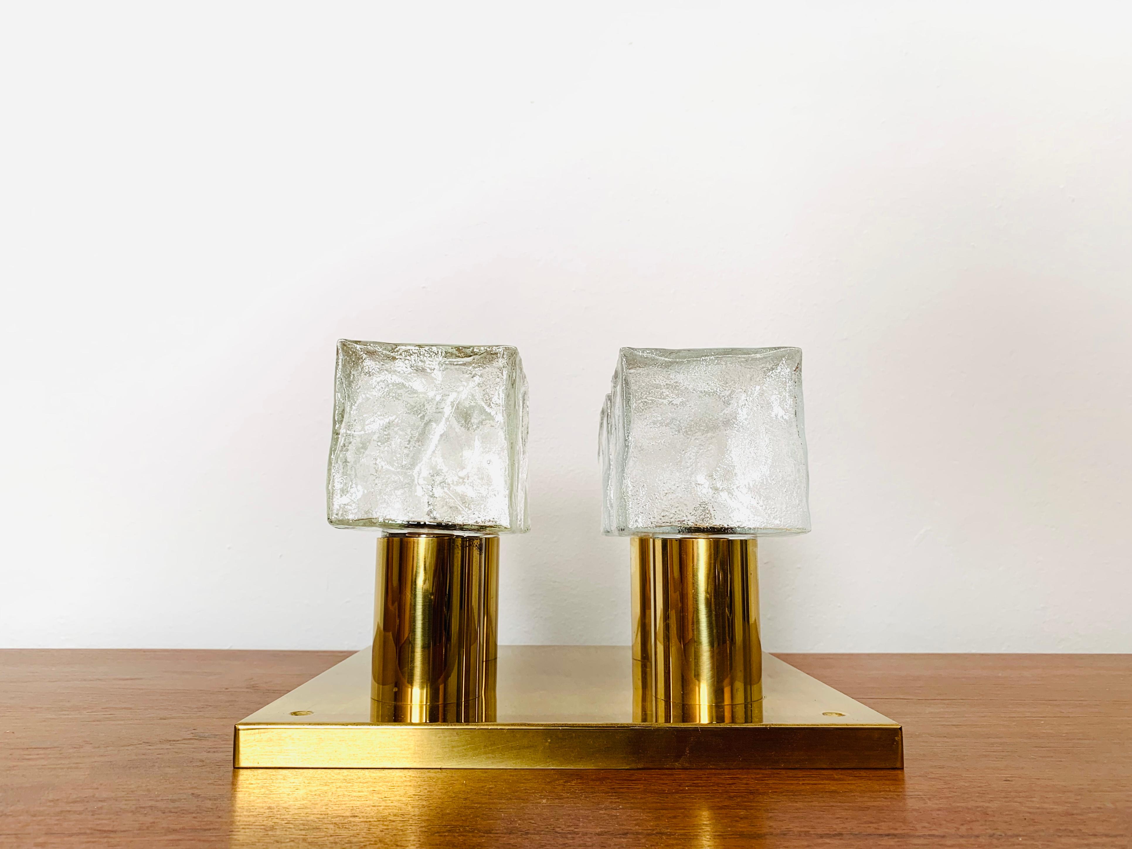 Wonderful ice glass ceiling lamp from the 1960s.
The beautifully formed Murano glass elements create an impressive, sparkling play of light.
Very high-quality workmanship and a real eye-catcher for every home.

Design: J.T. Kalmar
Manufacturer: