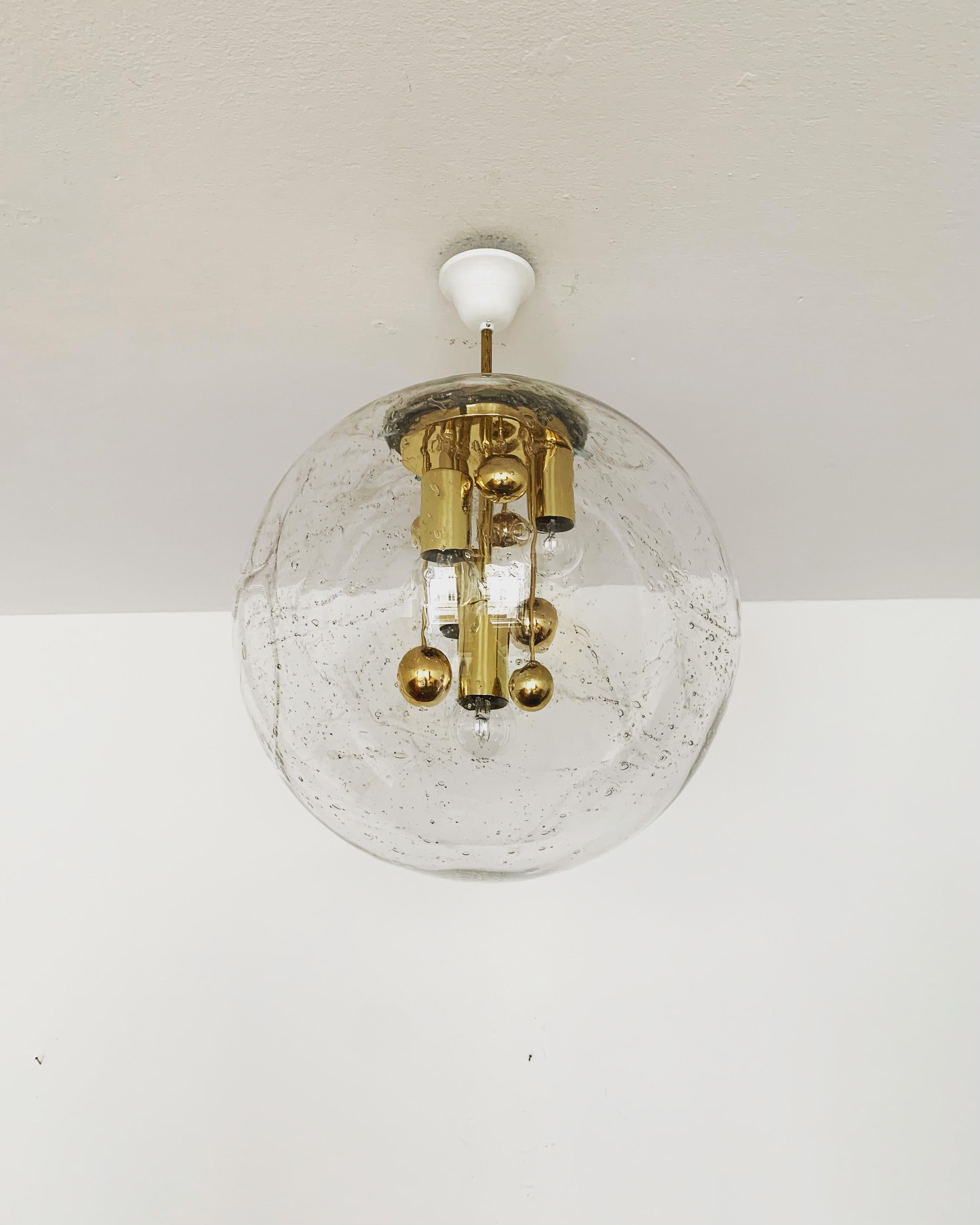 Very beautiful and large golden Big Ball lamp by Doria from the 1960s.
Very elegant Hollywood Regency design with a fantastically glamorous look.
The structure in the glass creates a very sparkling light.

Manufacturer: