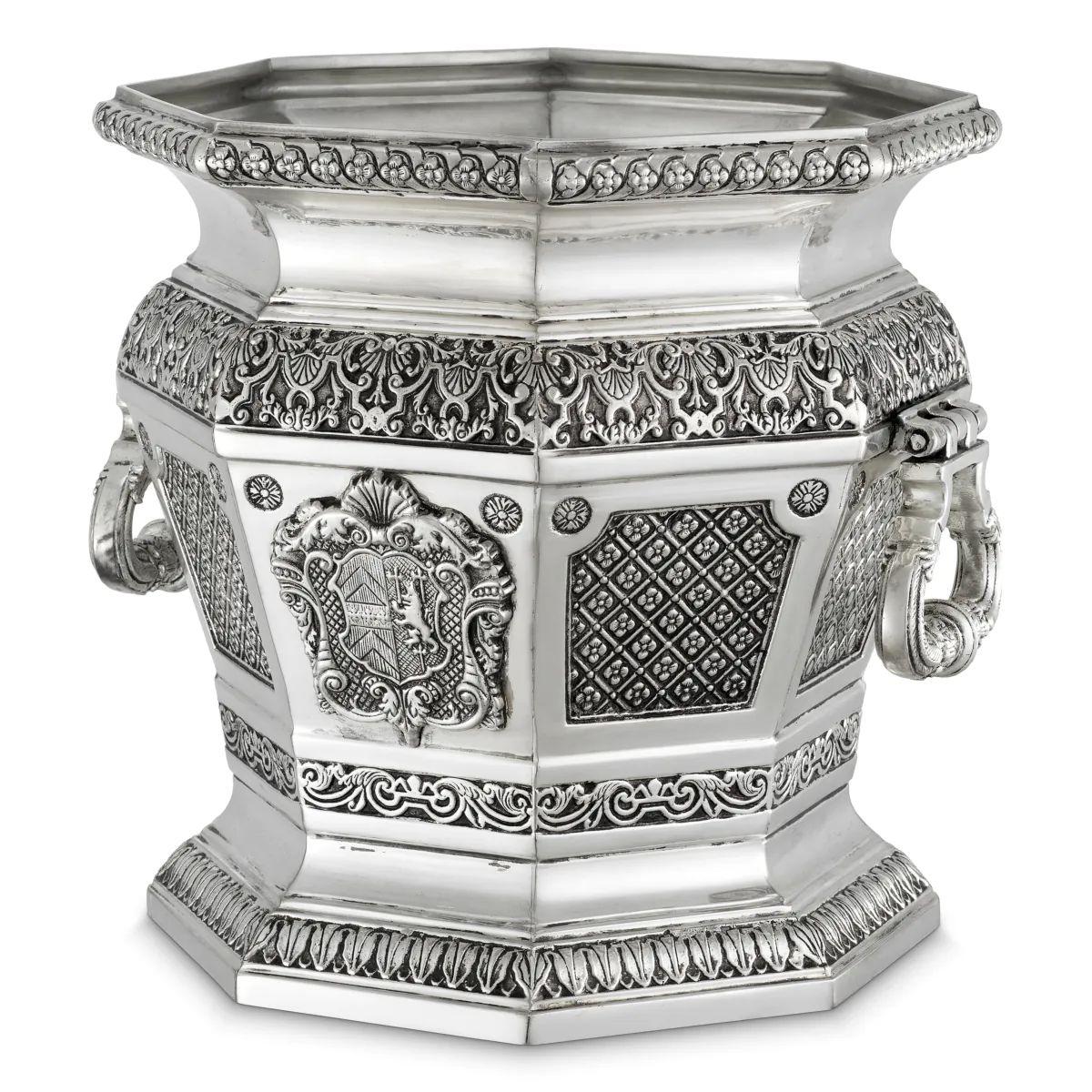 This decorative object in antique silver finish is a sculptural piece designed to bring historical refinement and contemporary elegance into modern interiors. Crafted with an antique silver plated surface, the decorative object offers a rich patina