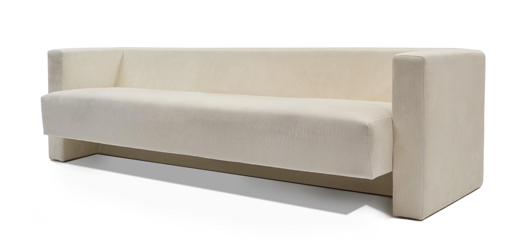 The Minimalist lines of the ice velvet sofa inspired by John Lautner's 1970s interiors, create a contemporary yet timeless piece. The softness and luxury of the velvet contrasts with the rigid lines of its design, where form follows function, and