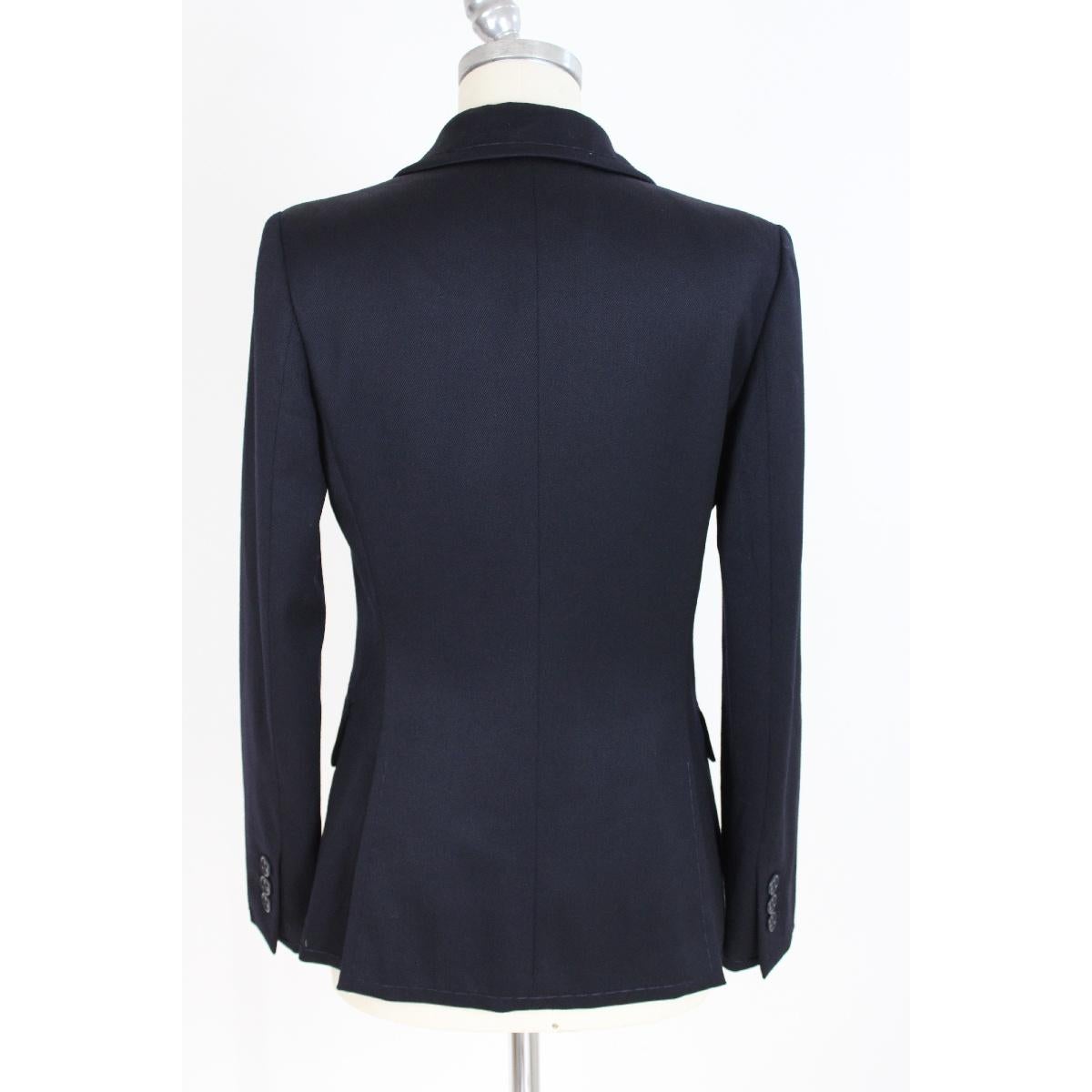 Iceberg 90s vintage women's jacket. Dark blue double-breasted jacket, 98% wool, 2% elastane fabric. Made in Italy. Excellent vintage condition

SIZE 42 IT 8 US 10 UK

Shoulders: 42 cm
Length: 75 cm
Bust / chest: 46 cm
Sleeves: 60 cm