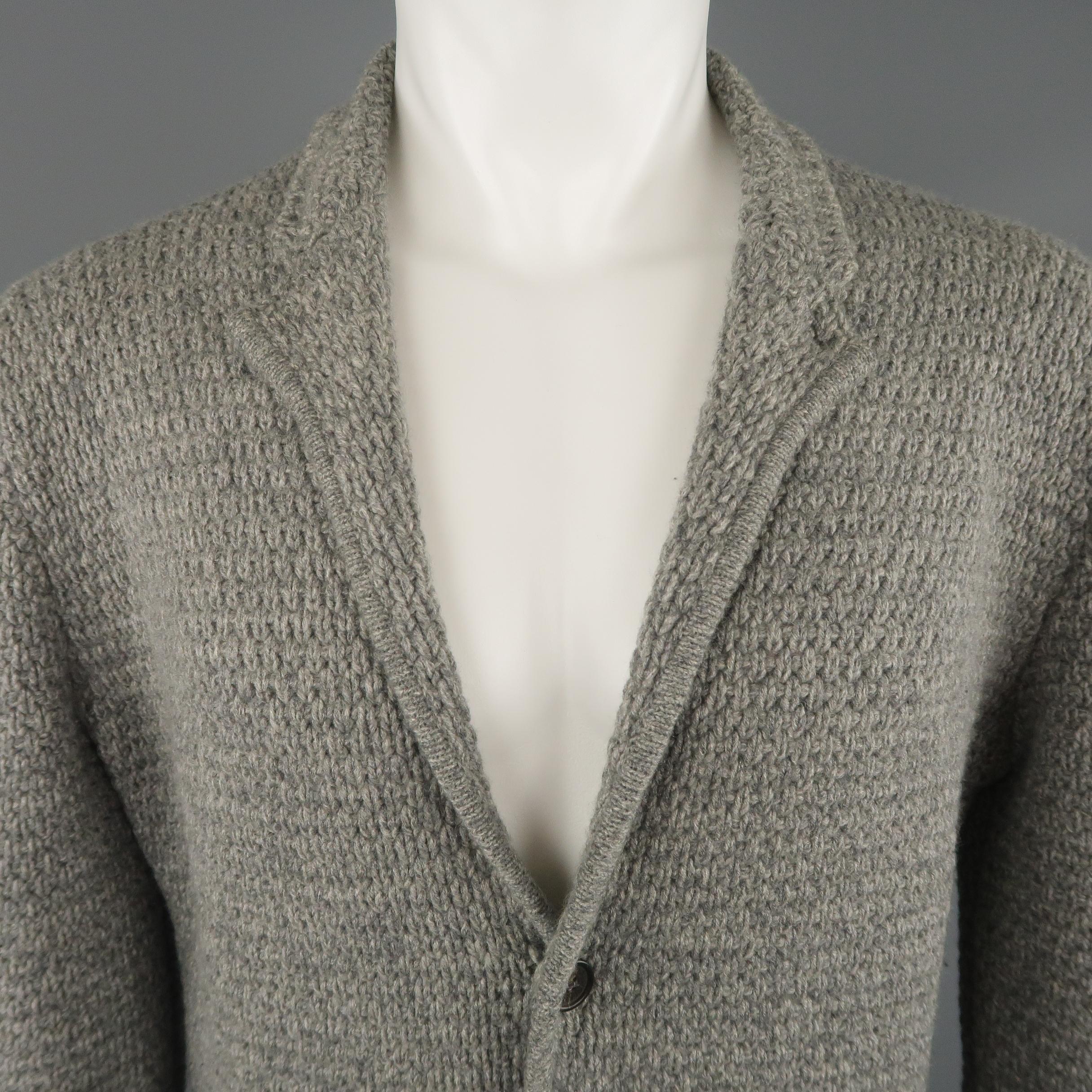 ICEBERG cardigan jacket comes in a heather gray wool blend textured knit with a notch lapel, patch pockets and button up.  Made in Italy
 
Excellent Pre-Owned Condition.
Marked: S
 
Measurements:
 
Shoulder: 17 in.
Chest: 40 in.
Sleeve: 27