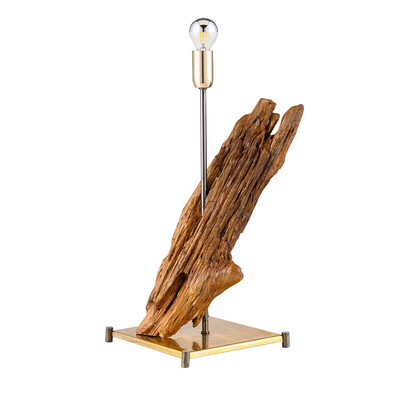 With its one-off base in reflective pure gold stainless steel and black brass feet, the Iceberg lighting sculpture features a piece of sea wood, from the Amalfi Coast, surrounding a black steel rod supporting a lamp holder with a spherical white and