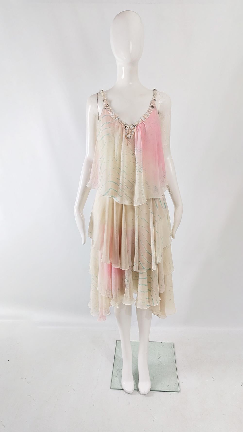An incredibly pretty vintage womens dress from the 2000s by luxury Italian fashion house, Iceberg. Made in Italy, from tiers of cream, pink and blue ombré silk chiffon which give an ethereal look. It has statement beading around the neckline -