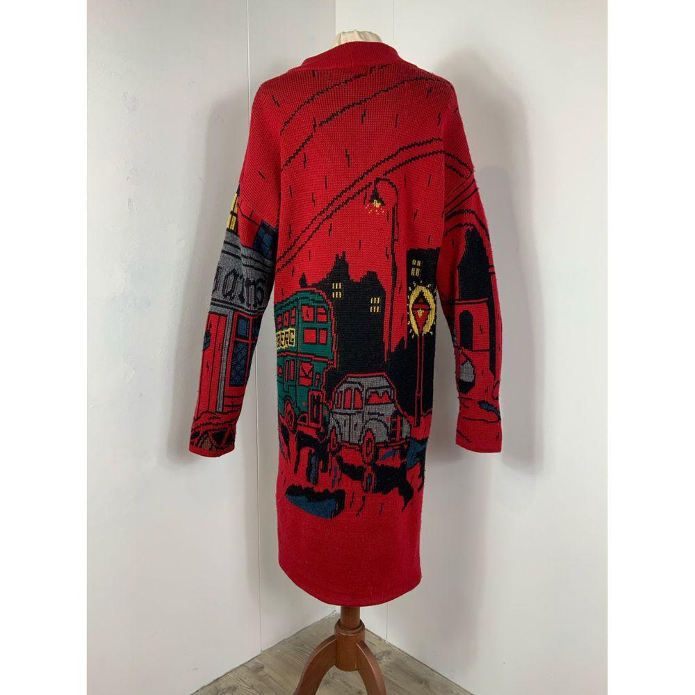 Iceberg Wool Jumper in Red

Iceberg Sweater / Dress. 
In Wool. London pattern. 
Italian size 40, but fits large. 
Measures 44 cm at the shoulders, 50 cm at the bust, 108 cm long and 53 cm at the sleeve. 
Good general conditions , shows signs of