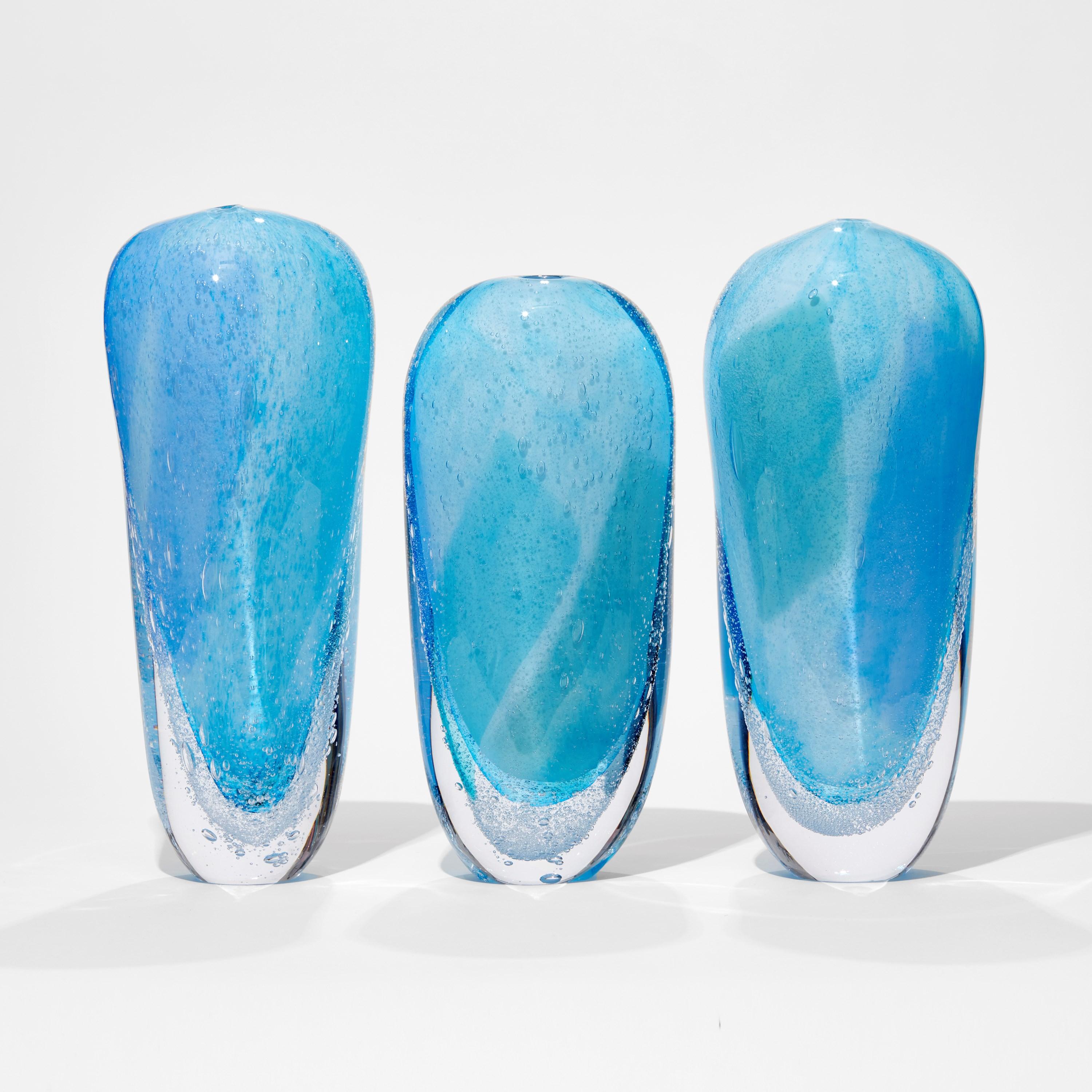'Icebergs' is a unique set of glass sculptures by the British artist, Cathryn Shilling. 

The price shown is for the set of 3 artworks, which range in height from 33 - 37cm H. The dimensions above are for the tallest artwork in the