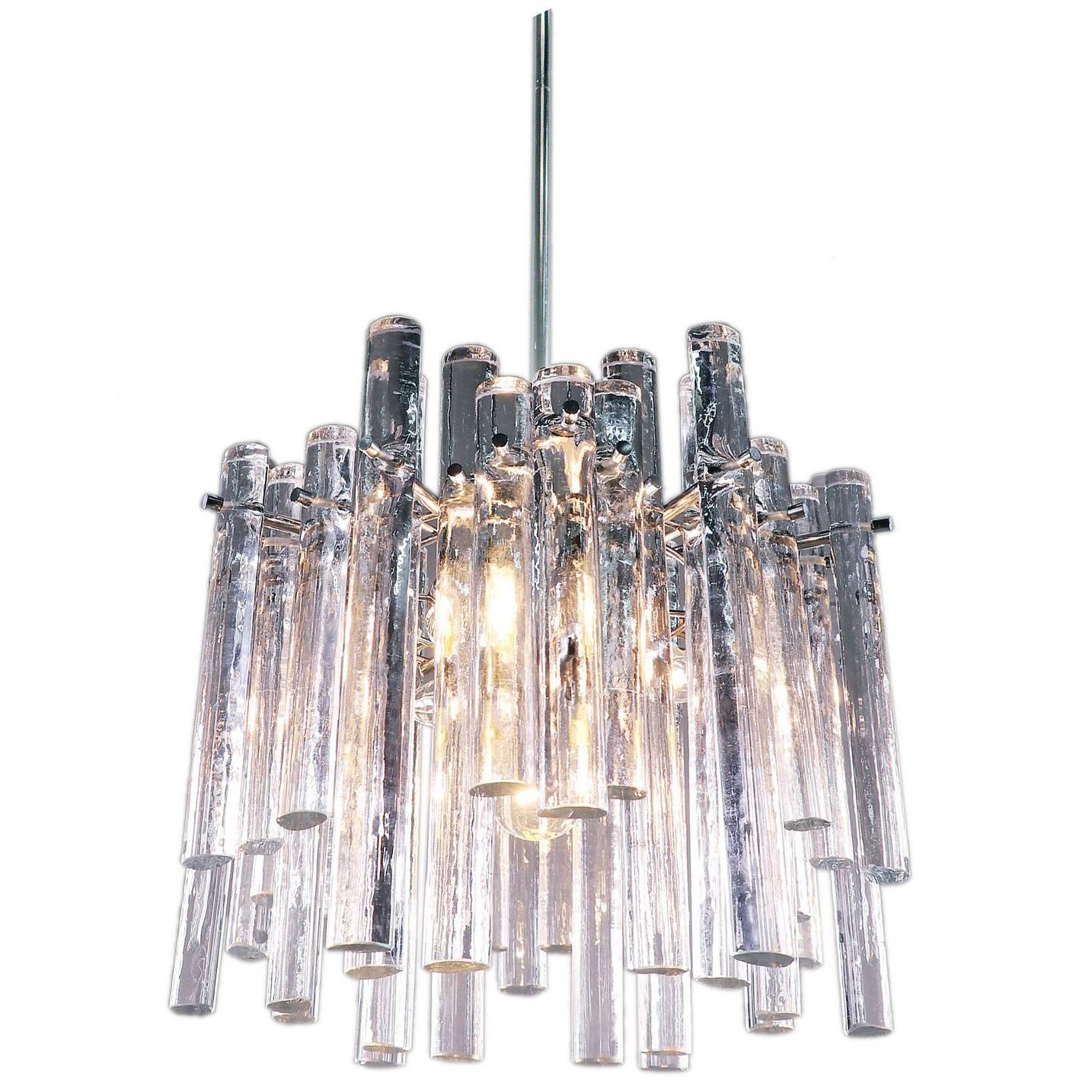 Elegant iced sticks chandelier with heavy crystal glass rods of various lengths on a chromed metal frame. Hanging glass resembles icicles. Chandelier illuminates beautifully and offers a lot of light. Gem from the time. With this light you make a