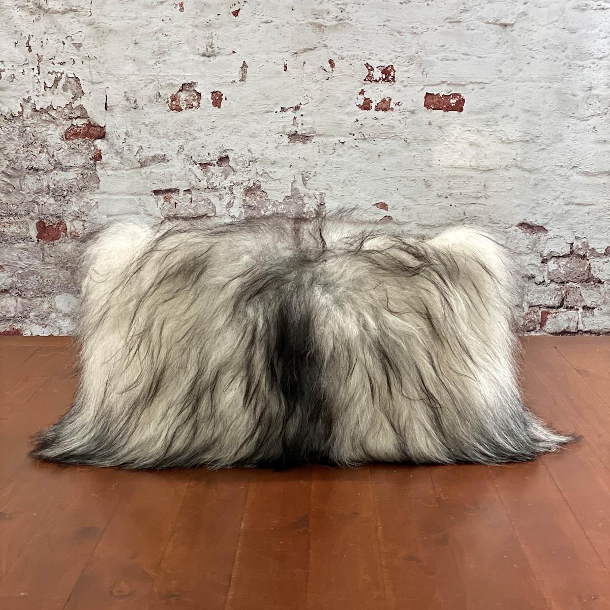 Complete an interior with this striking one-of-a-kind, Icelandic sheepskin pillow. Handcrafted from beautiful and high-quality Icelandic sheepskin, a natural by-product from the glaciers of Iceland.

This charming rectangle pillow expresses the