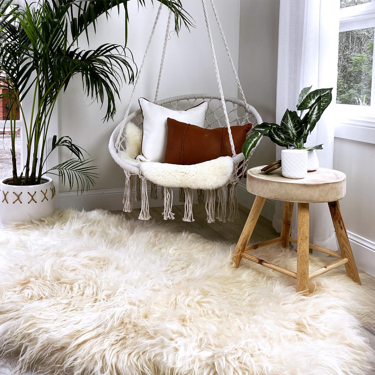 This Icelandic sheepskin rug is sustainable, natural living at its finest. This natural white sheepskin rug is handcrafted from the highest quality long wool Icelandic sheepskin creating an extraordinary shaggy area rug with a wool pile range from 8