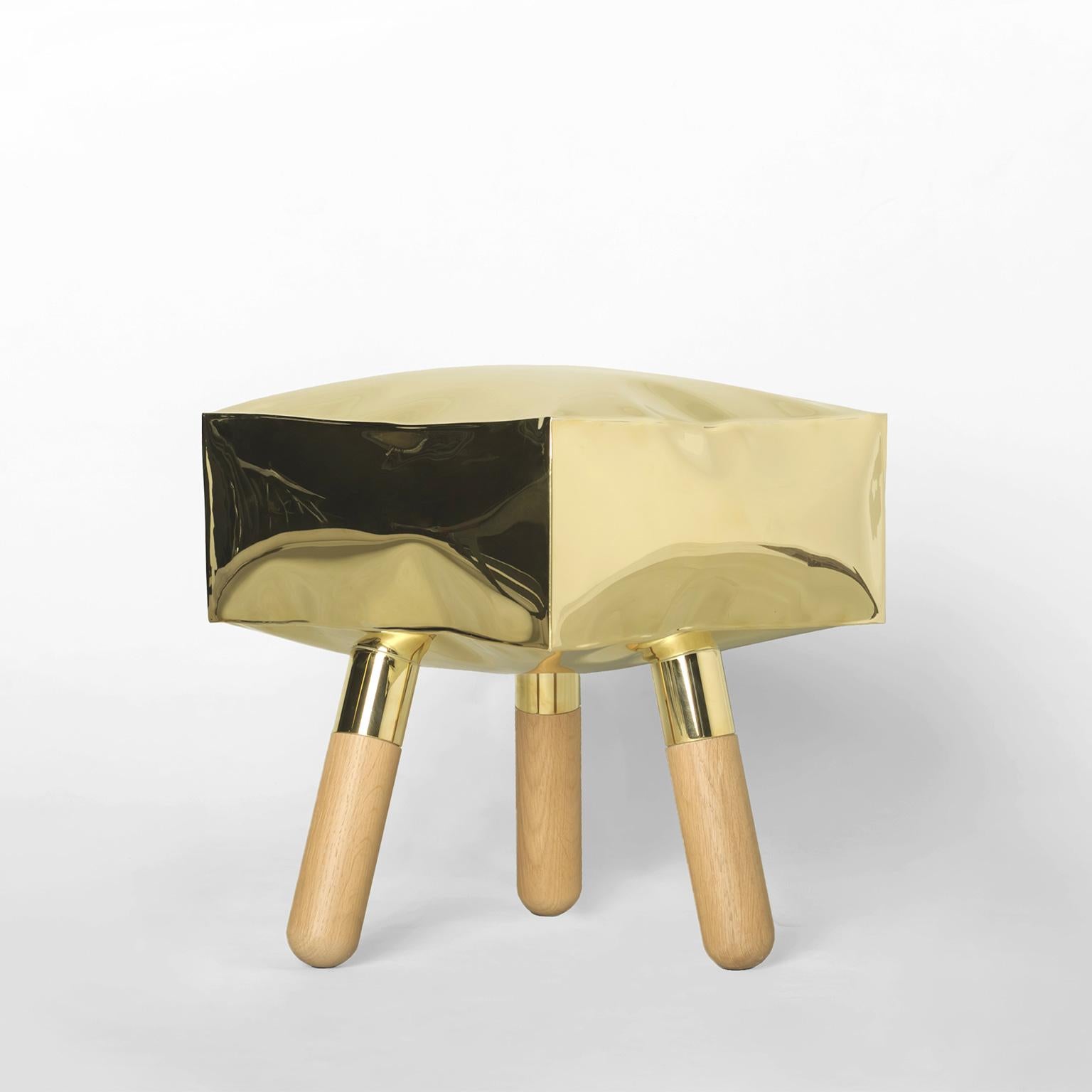 This 21st Century brass stool is a product of Italian craftmanship, the unique effect is created by the expansion of ice within the seating. It is manufactured in a limited edition of 15 signed and progressively numbered examples. The stool is part