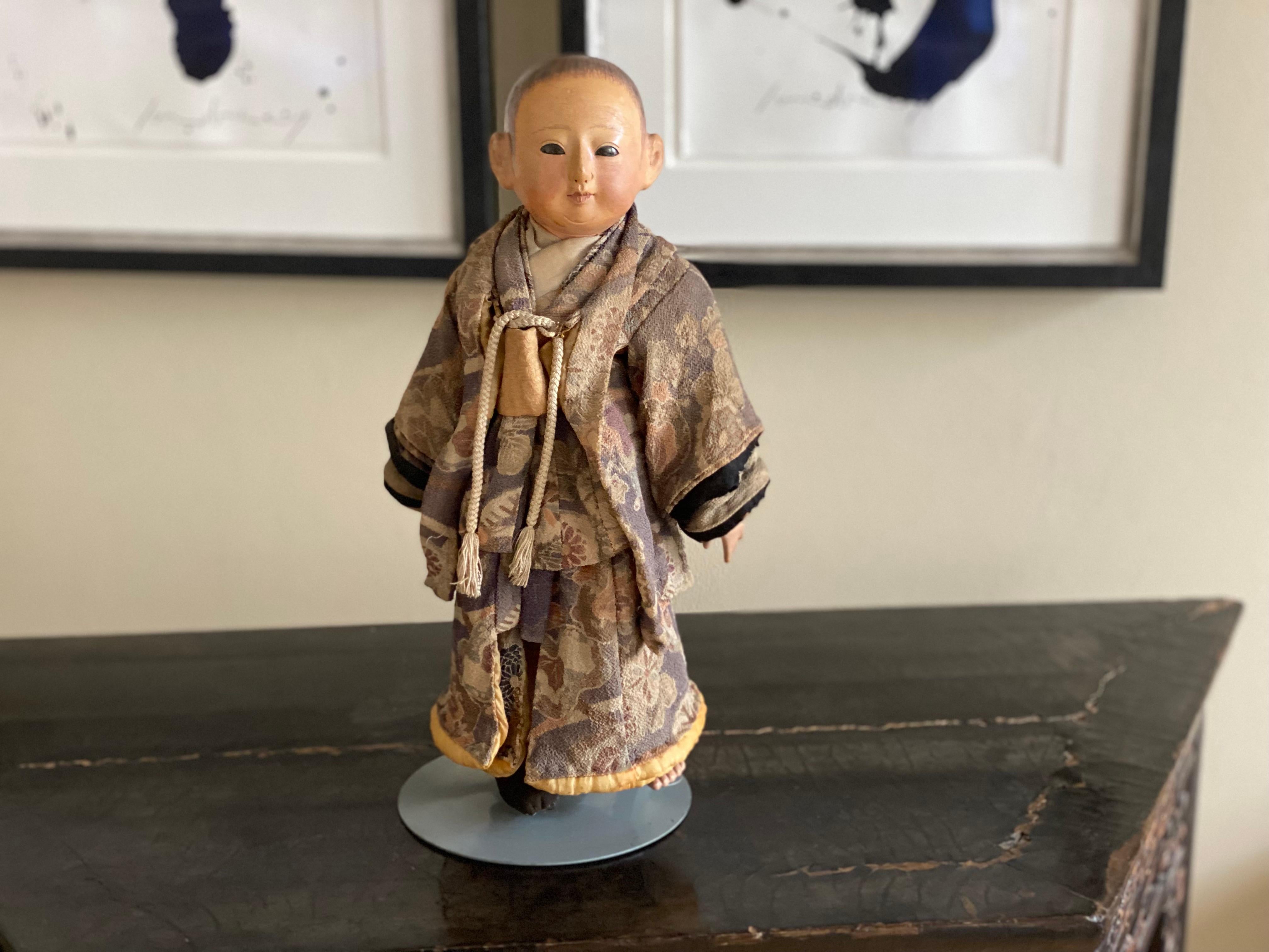 Ichimatsu Ningyo doll is a Japanese shell limestone doll from the Meiji period. The doll body as well as the head, forearms, hands, legs and feet are made of shell limestone, only the upper arms are made of fabric.

This little guy is just great,