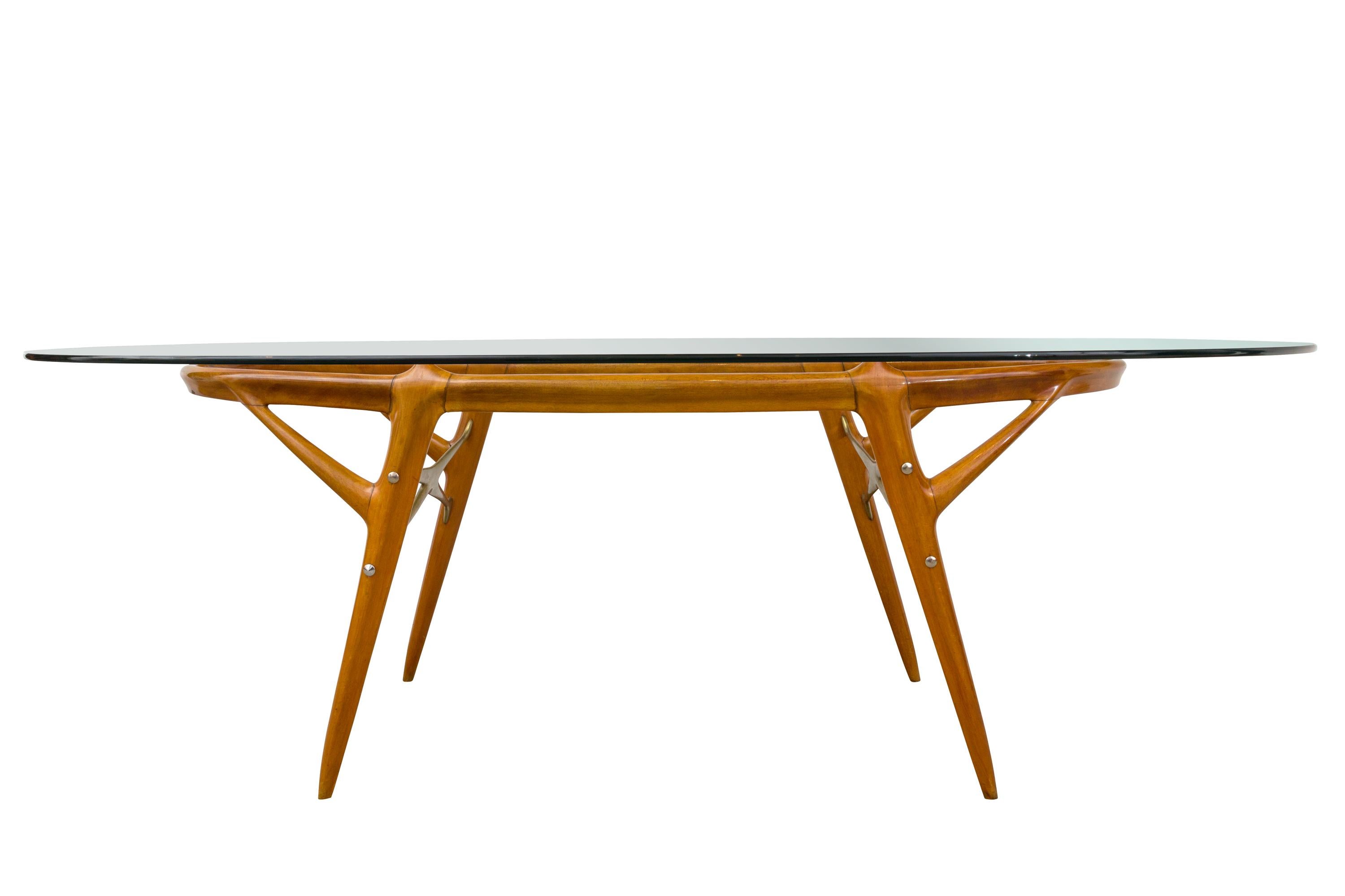 Italian Walnut and Brass Dining Table in the style of Ico Paroso, circa 1955. Ico Parisi was an Italian architect and designer born in 1916 in Palermo, Italy. He was involved in building construction and architecture in Como during his early