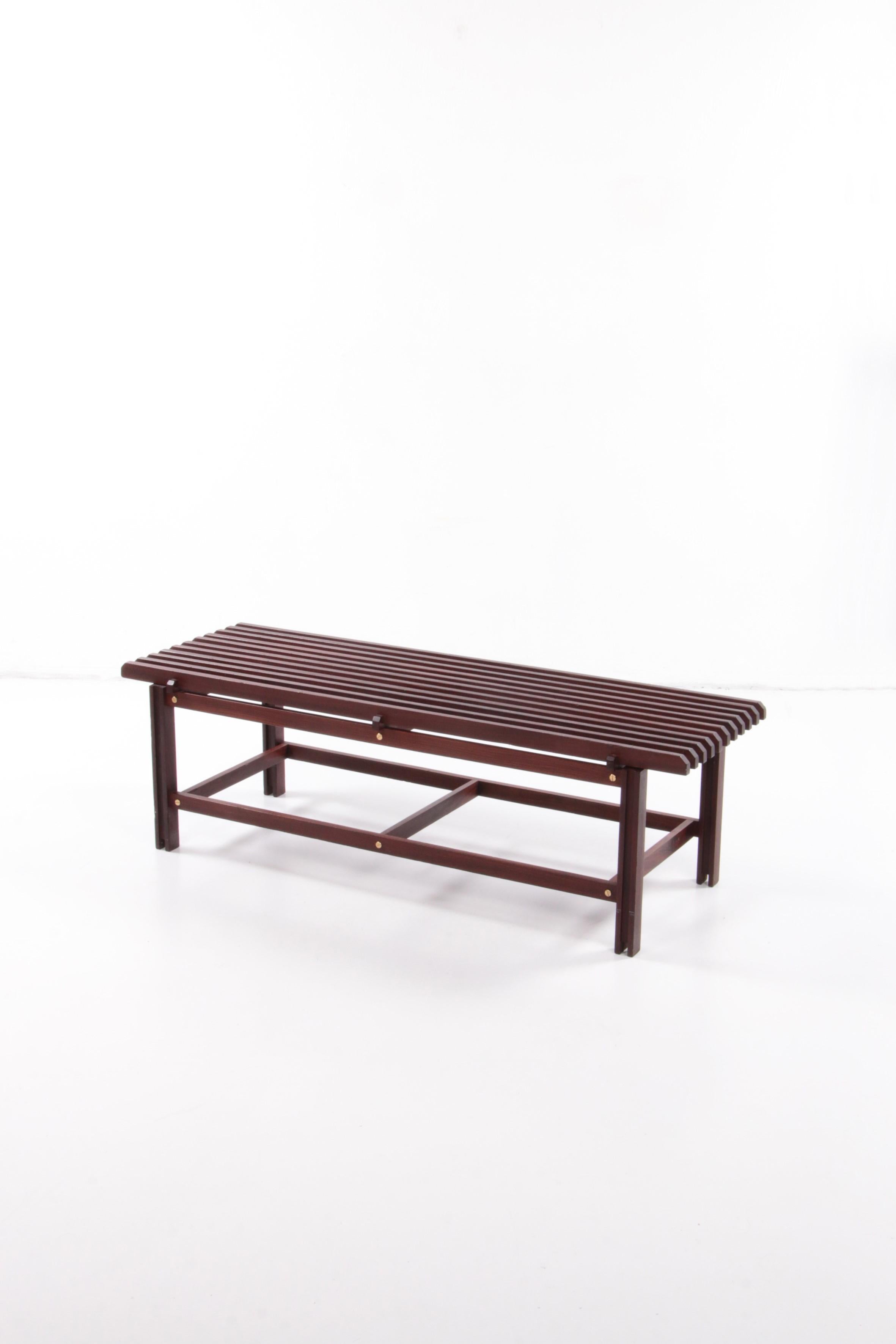 Discover the timeless beauty of the Ico & Luisa Parisi wooden bench, a 1960 masterpiece made in Italy. This elegant piece of furniture embodies the modern Italian style of the 1950s and is a real eye-catcher in any interior. The bench is carefully