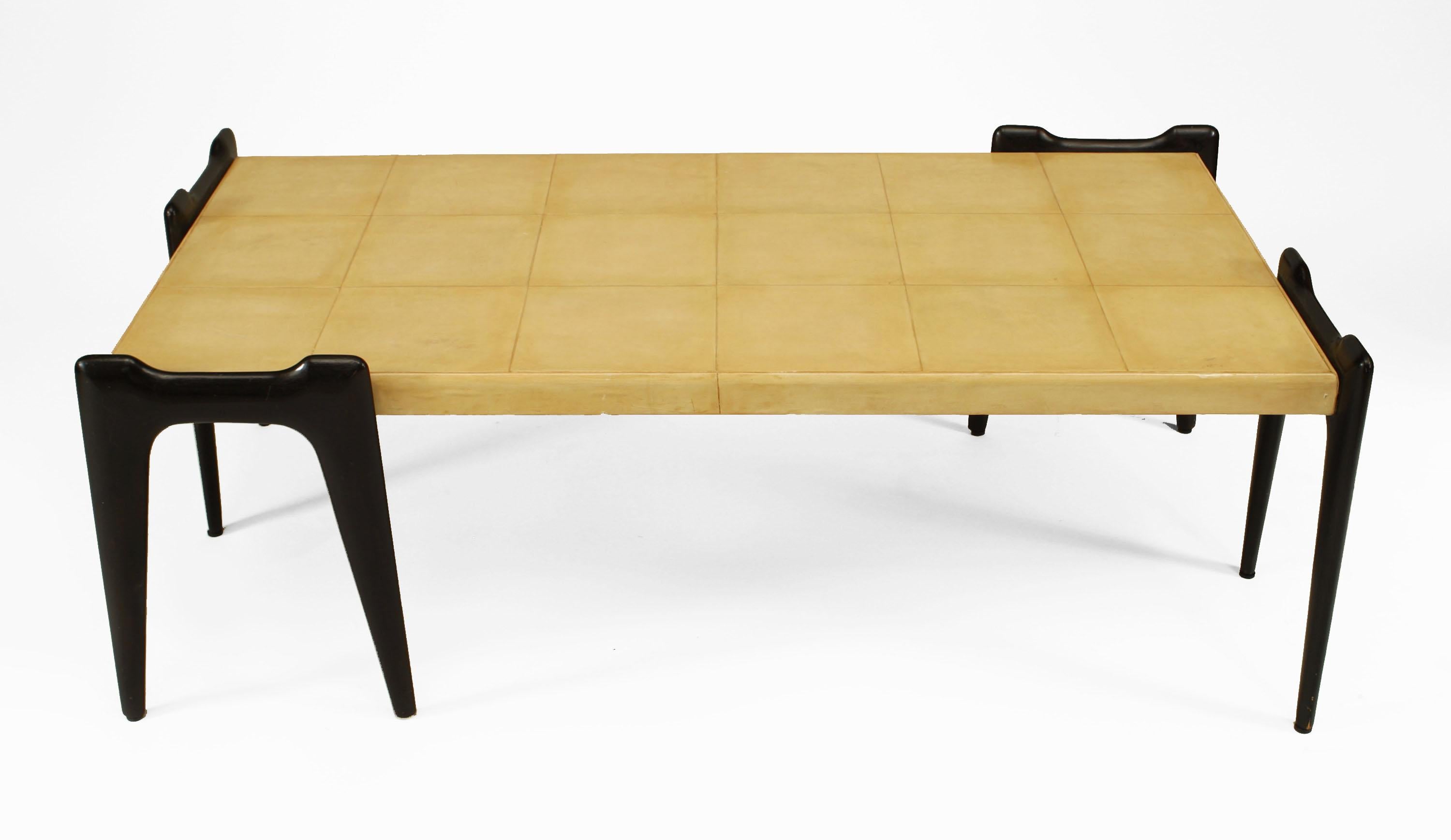 Attributed to Ico Parisi and crafted in Italy in the 1940's, this rectangular coffee table is distinguished by its parchment veneer finish applied in rows of 3