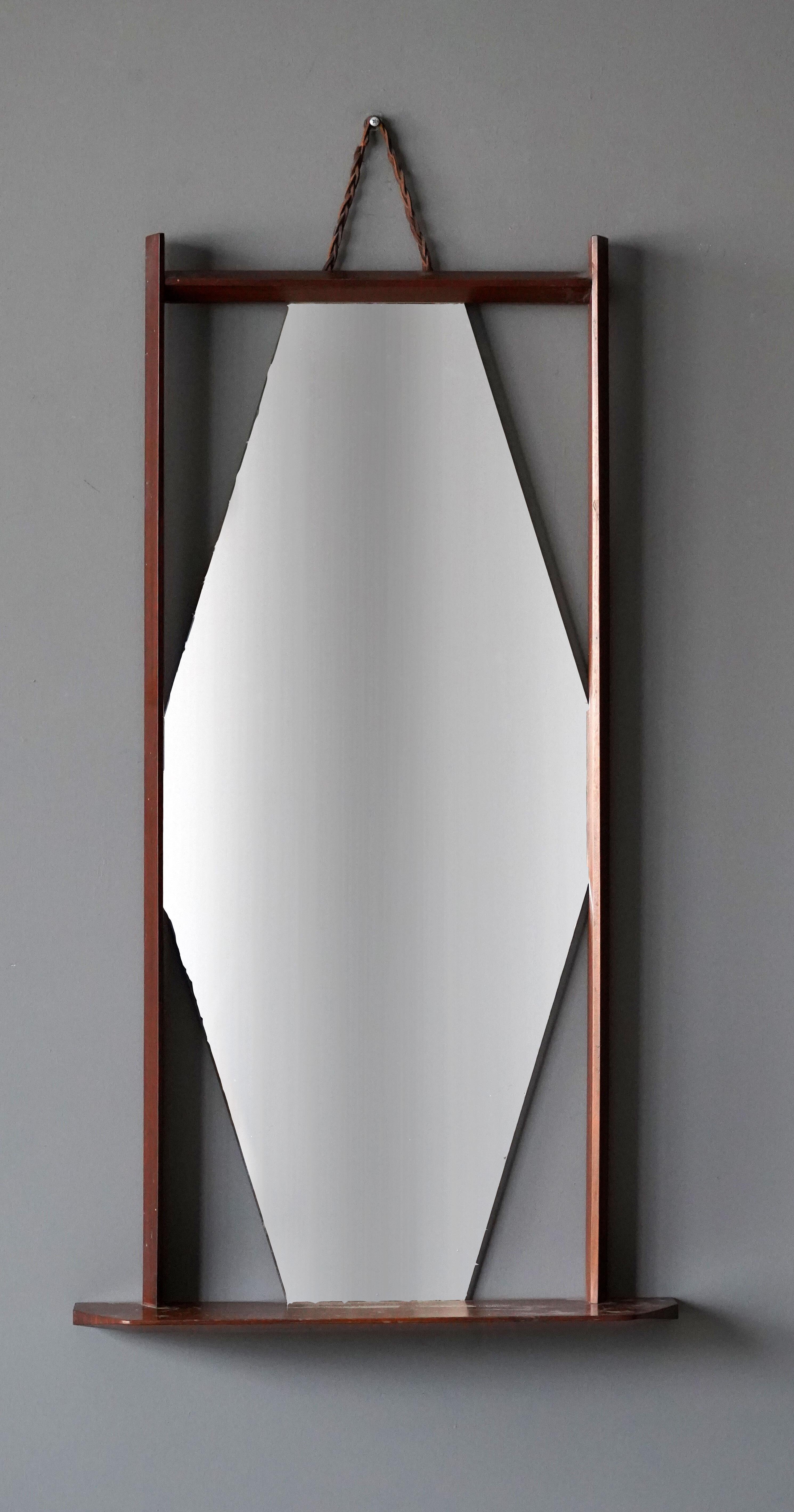 A wall mirror. Design attributed to Ico Parisi, compare model to the ‘Paraggi’ mirror. Produced in Italy, 1950s. 

 