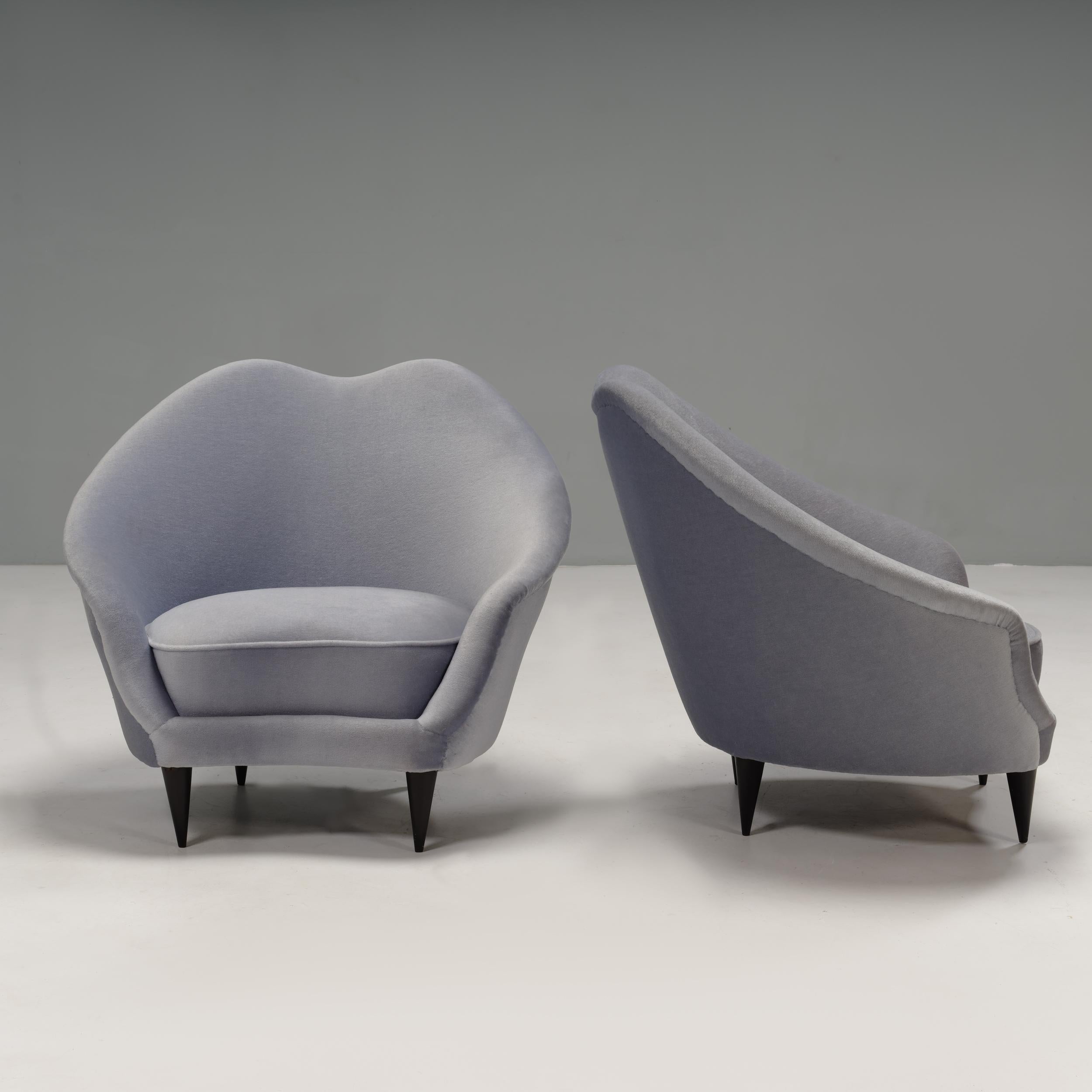 A stunning example of classic 1950s Italian design, these cocktail chairs were designed by Ico Parisi.

The armchairs feature a sculptural shape with a curved seat cushion and dipped backrest.

Both chairs are fully upholstered in pale blue Bruno