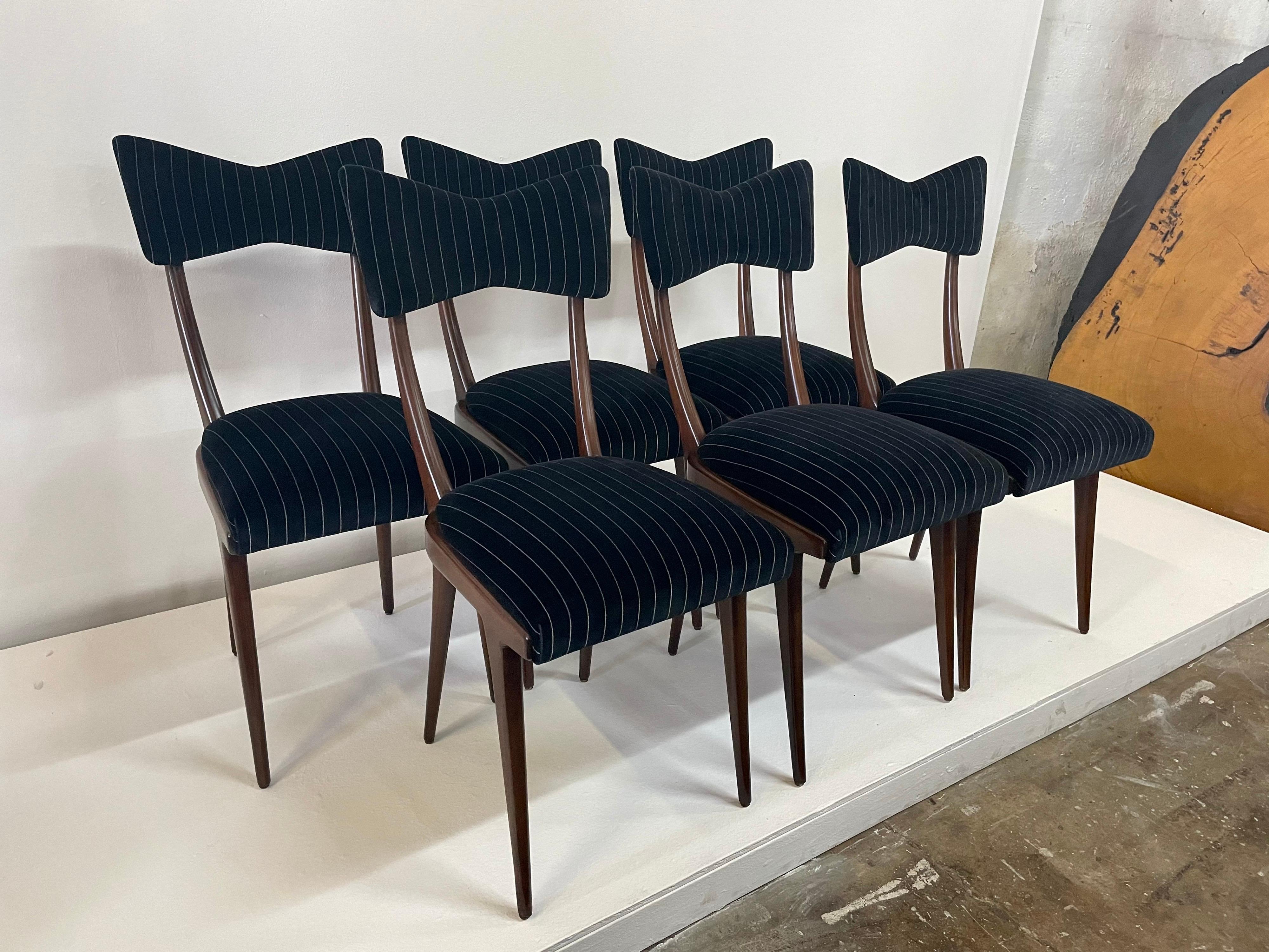 Upholstered in a chic black and white striped velvet, these stylish and iconic designer dining chairs are ready to use, excellent vintage condition.