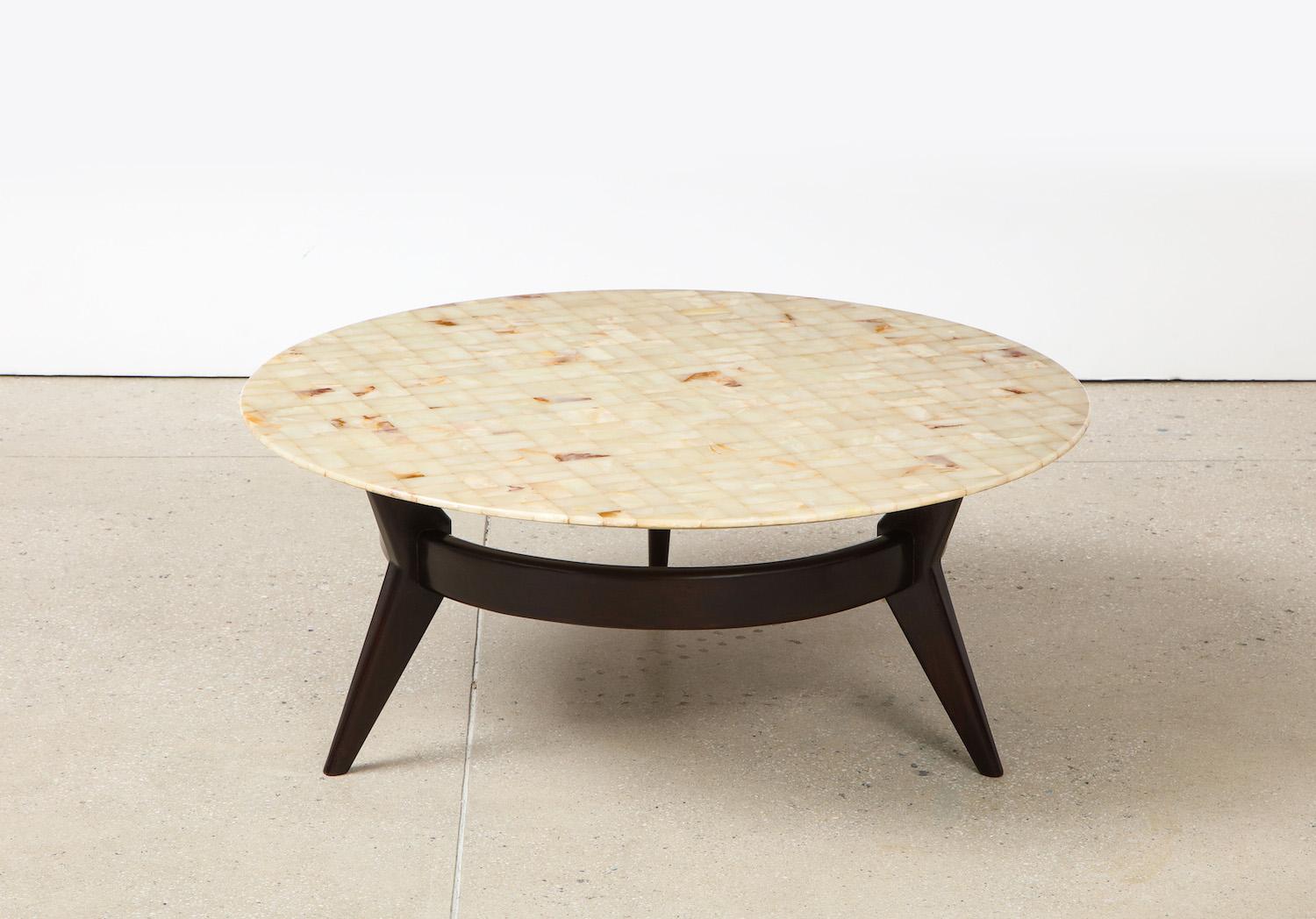Rare circular cocktail table by Ico Parisi. Circular low table of dark stained mahogany with wide center stretcher. Rare 3-legged variant. Removable top of onyx arranged into a mosaic pattern. Produced custom by Brugnoli Mobili, Cantù. Published: