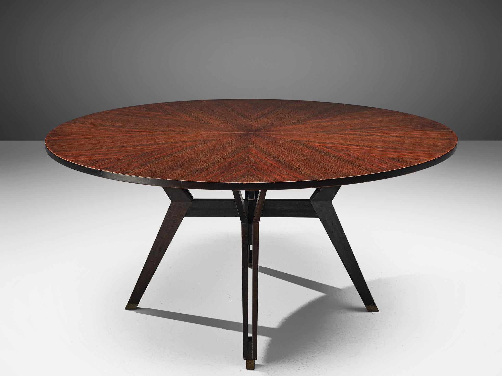 Ico Parisi for MIM Roma, dining table, rosewood and stainless steel, Italy, 1960s. Measures: 1.5m / 4,9 ft

This dining table is executed in Indian rosewood with stainless steel details. The table shows interesting lines and curves and is proved