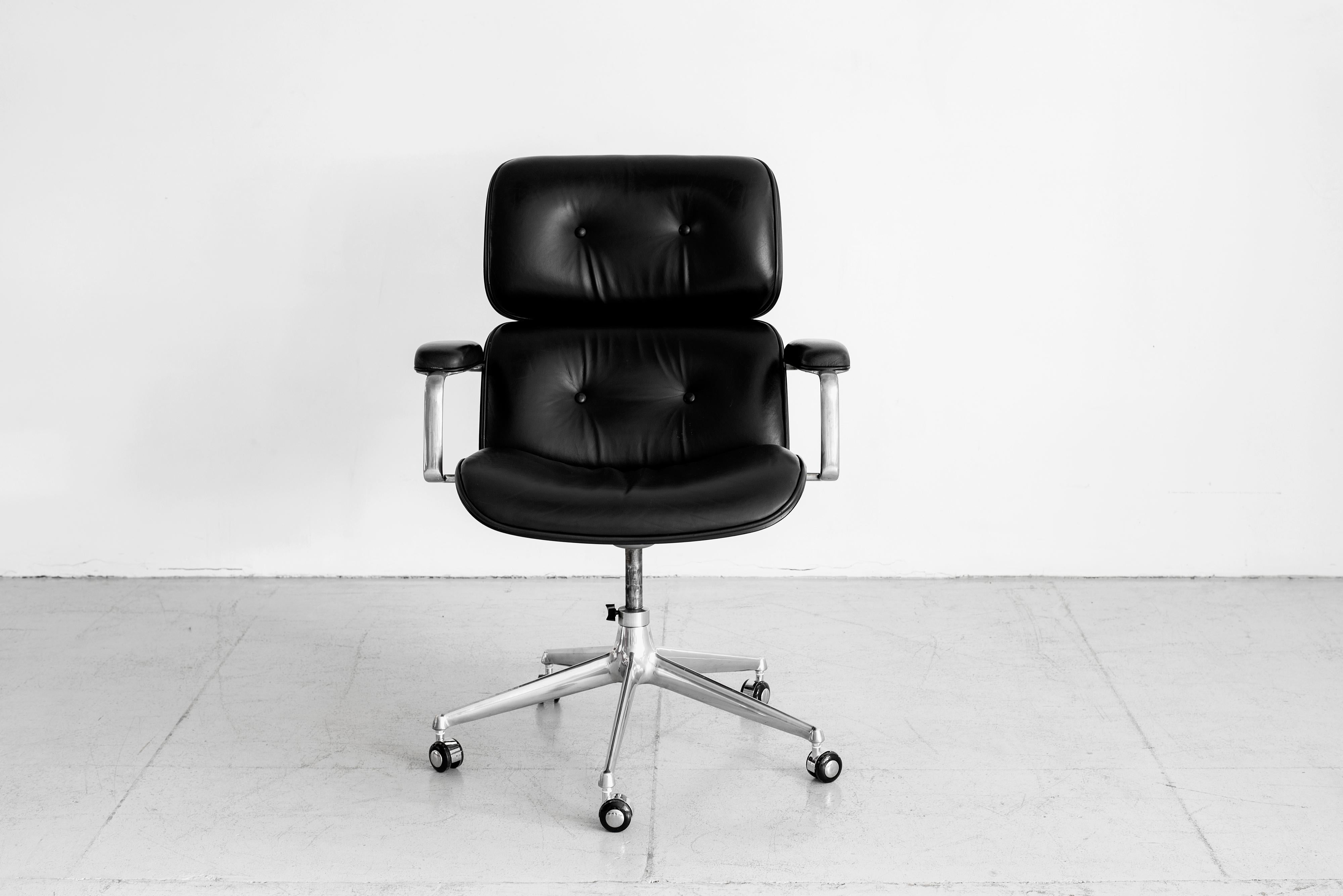 Handsome desk chair by Ico Parisi - manufactured by MIM, circa 1965
Cast aluminum base on casters with rosewood veneer back, black leather. 
Impressive in scale. 

 