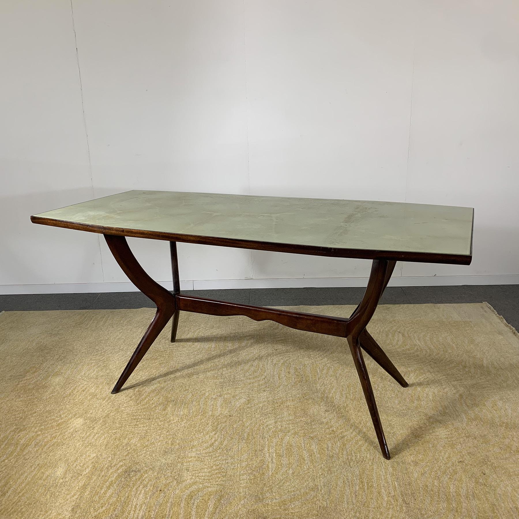 Dining table wooden frame with retro colored glass top in the style of Ico Parisi 1950s production.