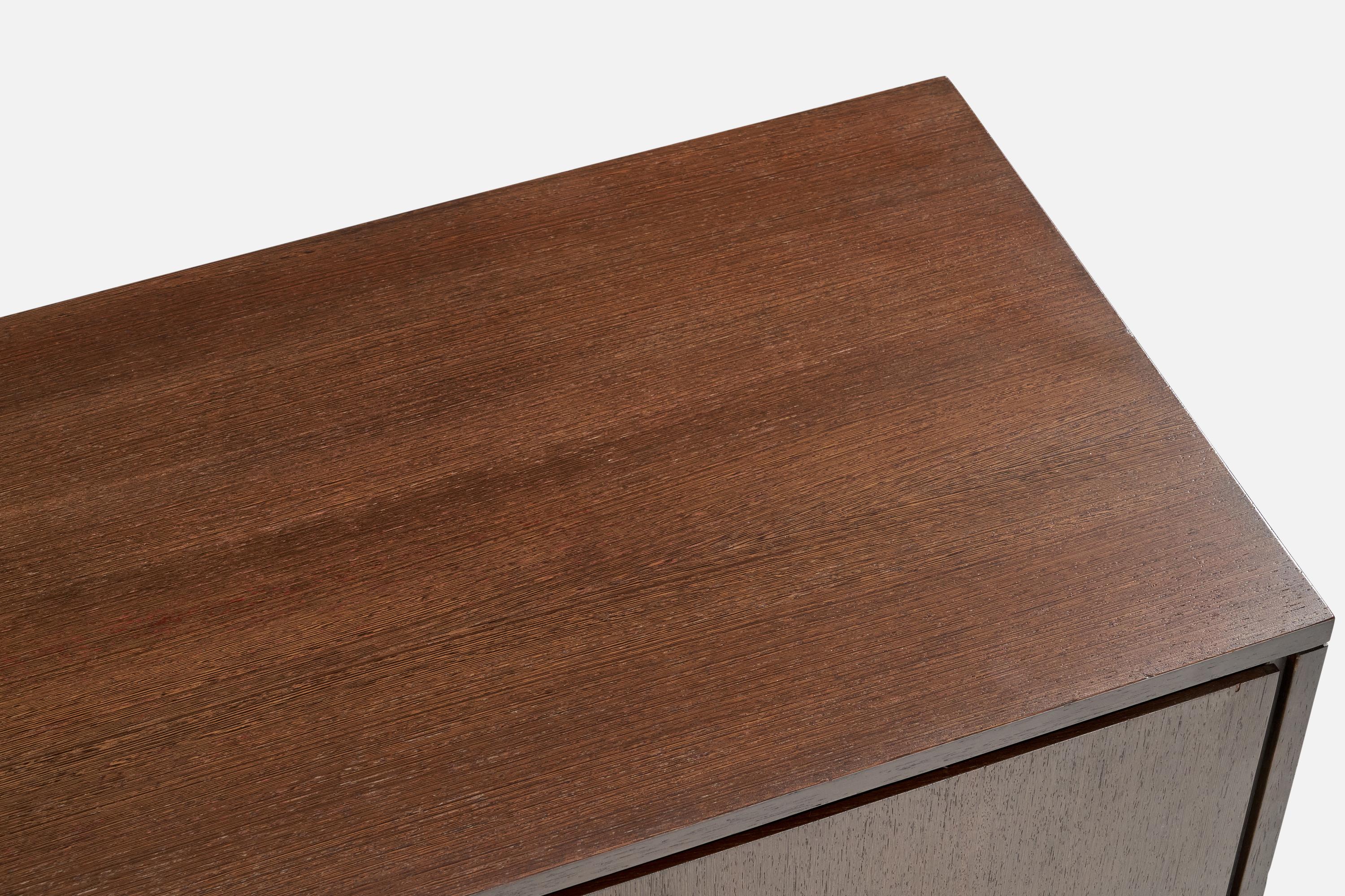 A dark-stained wood and brass dresser designed by Ico Parisi and produced by Colombo e Clerici, Italy, 1960s.

