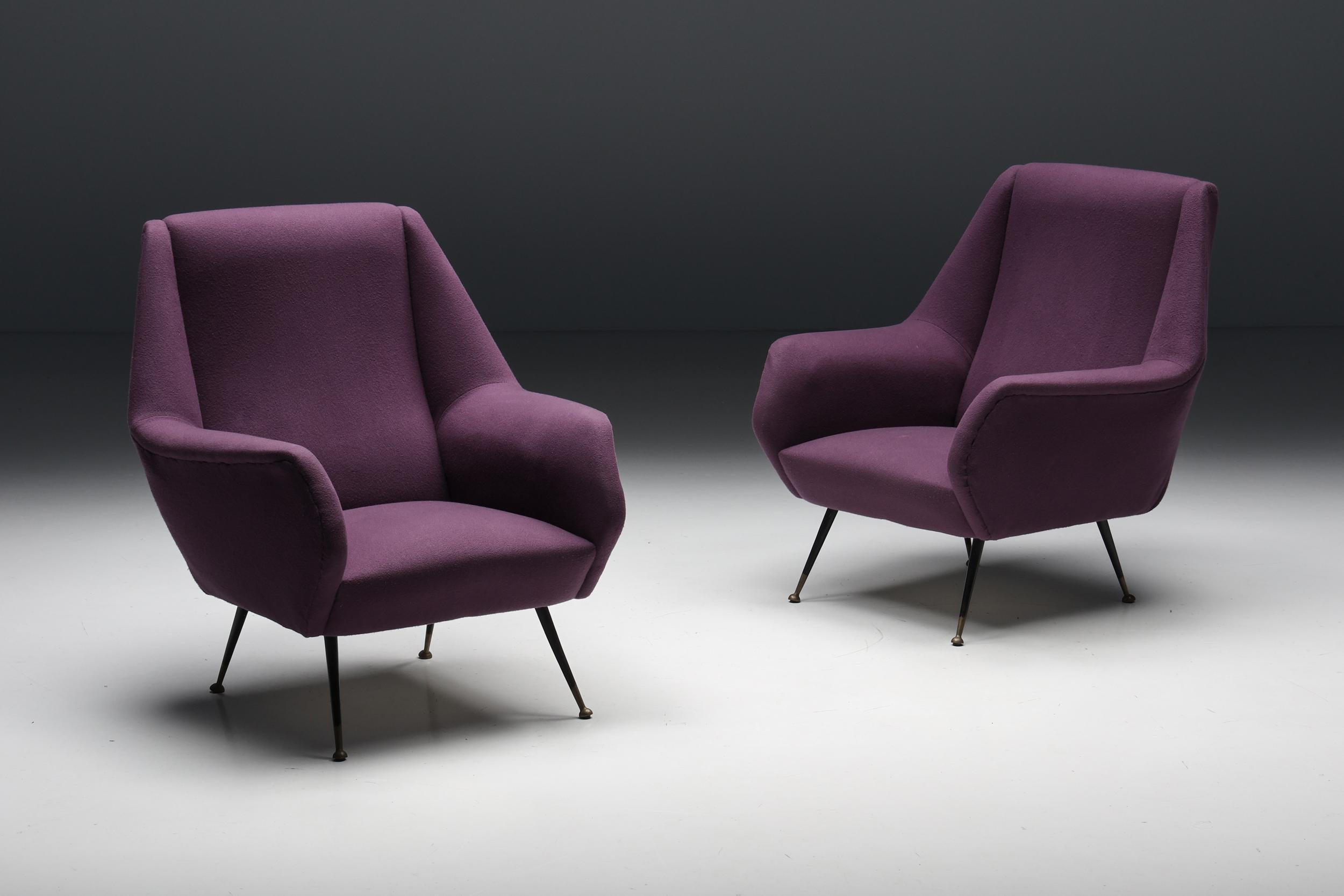 Italian pair of armchairs, by Ico Parisi, purple fabric.
Black metal legs which end on brass round feet.
1950s Italian chic lounge chairs which would fit well in an eclectic Hollywood Regency inspired interior.
 