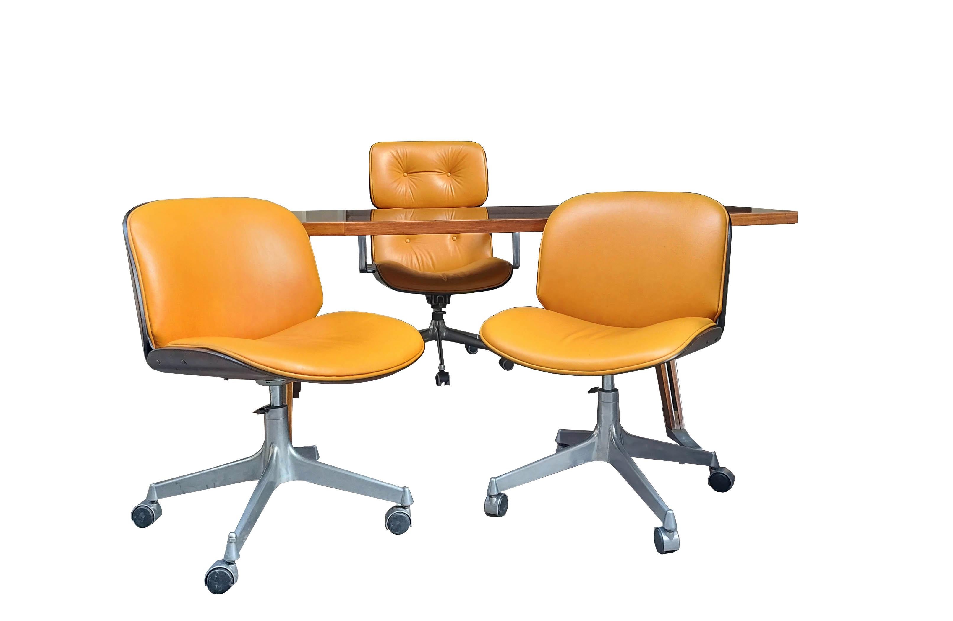 Rare office set designed by Ico Parisi for MIM Roma in the 1950s. Consisting of: Modern swivel desk chair on castors from the Temi series, with four-star cast aluminium base, wood veneer and original imitation leather upholstery; Pair of swivel