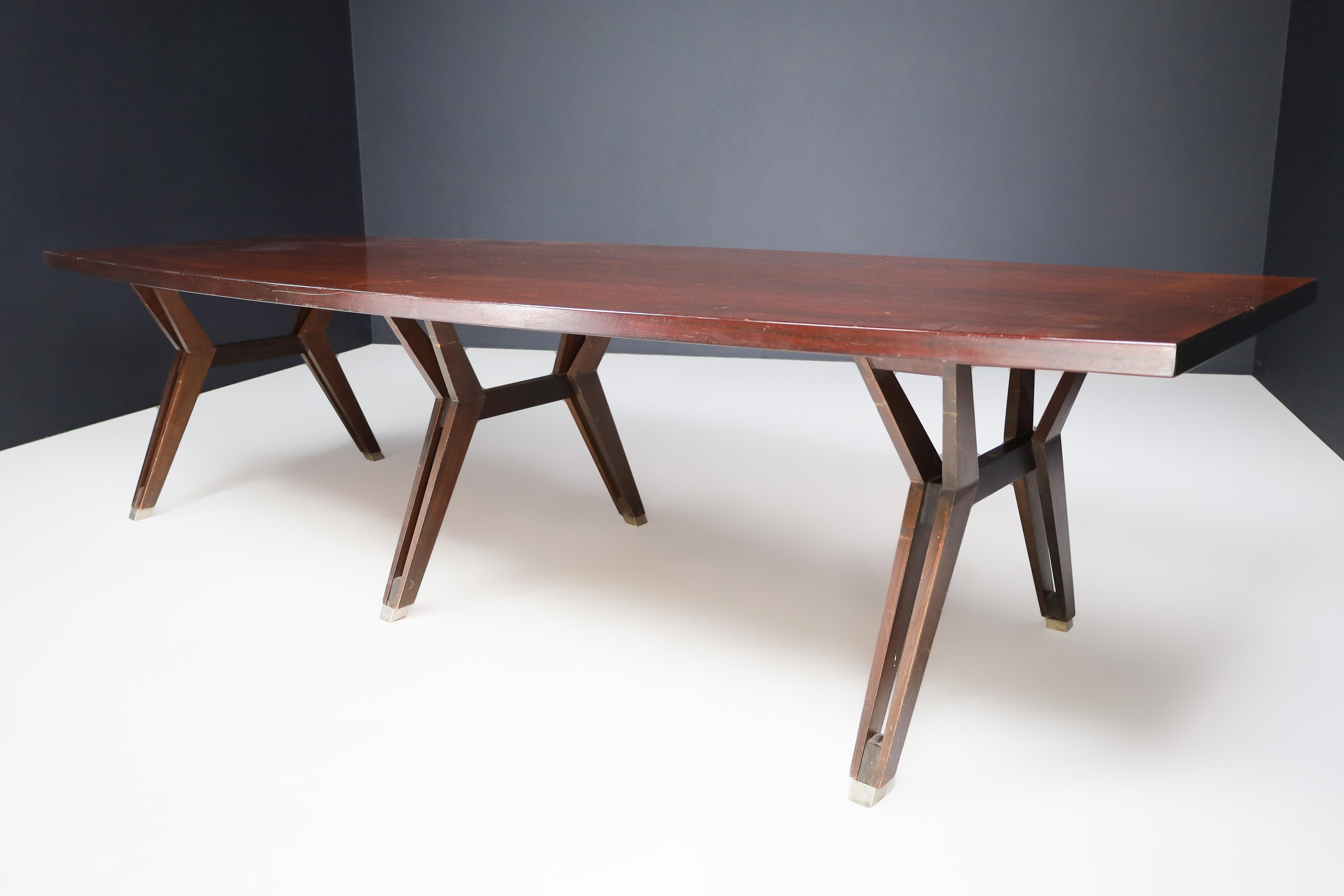 Ico Parisi for MIM Roma XL Large Dining Room Table, Italy 1950.

This is a large dining room table designed by Ico Parisi for MIM Roma, Italy in the 1950s. The table is made of dark polished wood with steel details and has a modernist design.