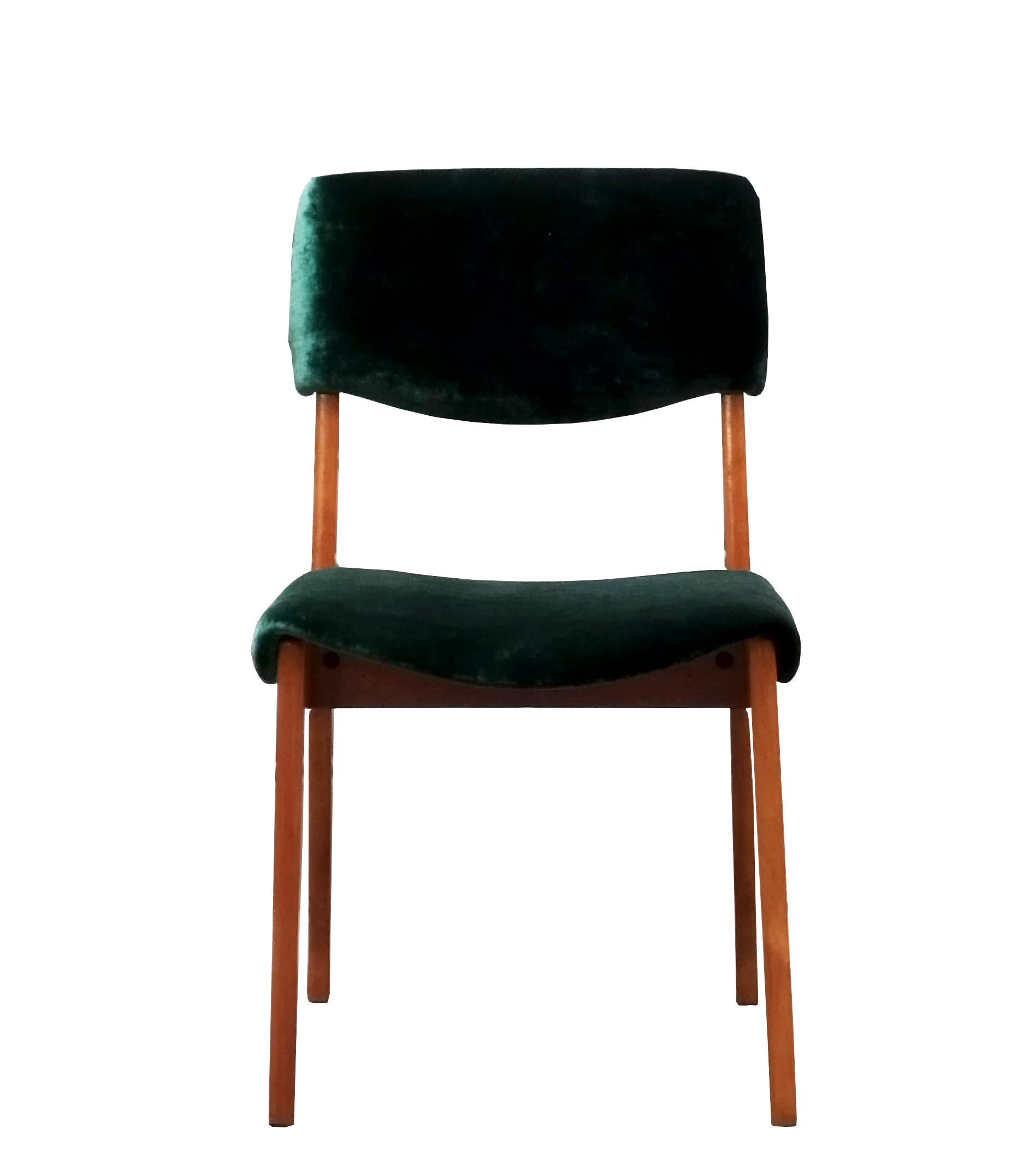 This chair was designed by Ico Parisi and manufactured by M.I.M. Rome in the 1950s. The combination of green upholstery and wood creates a balanced design. With manufacturer's label.