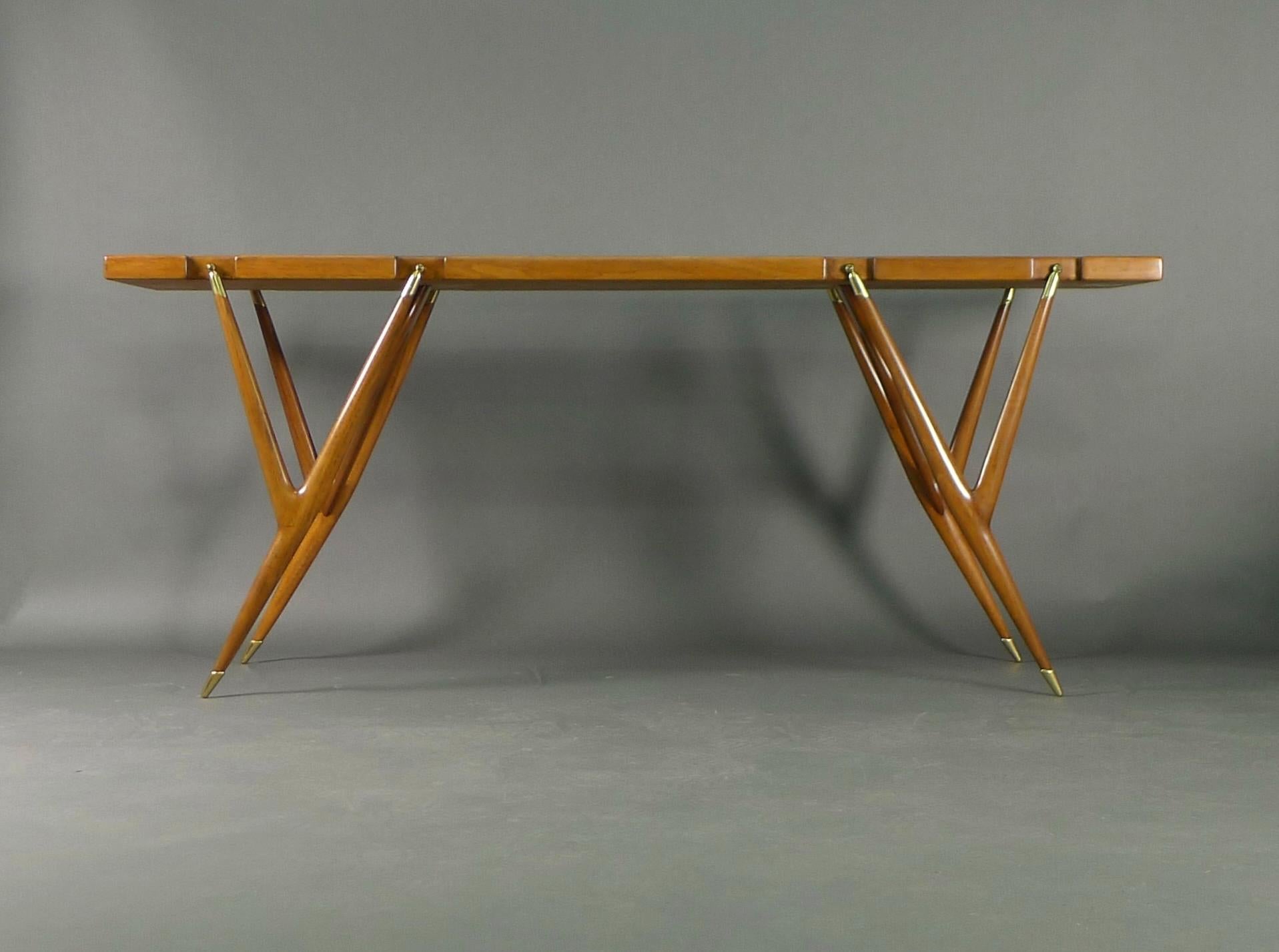 Ico Parisi for Singer & Sons, Console Table in solid walnut with brass fittings, 180cm long, 50cm deep, 75cm high

This stunning table features insets to the top for the Y shaped spindle legs, with brass caps and feet.  The underside bears the
