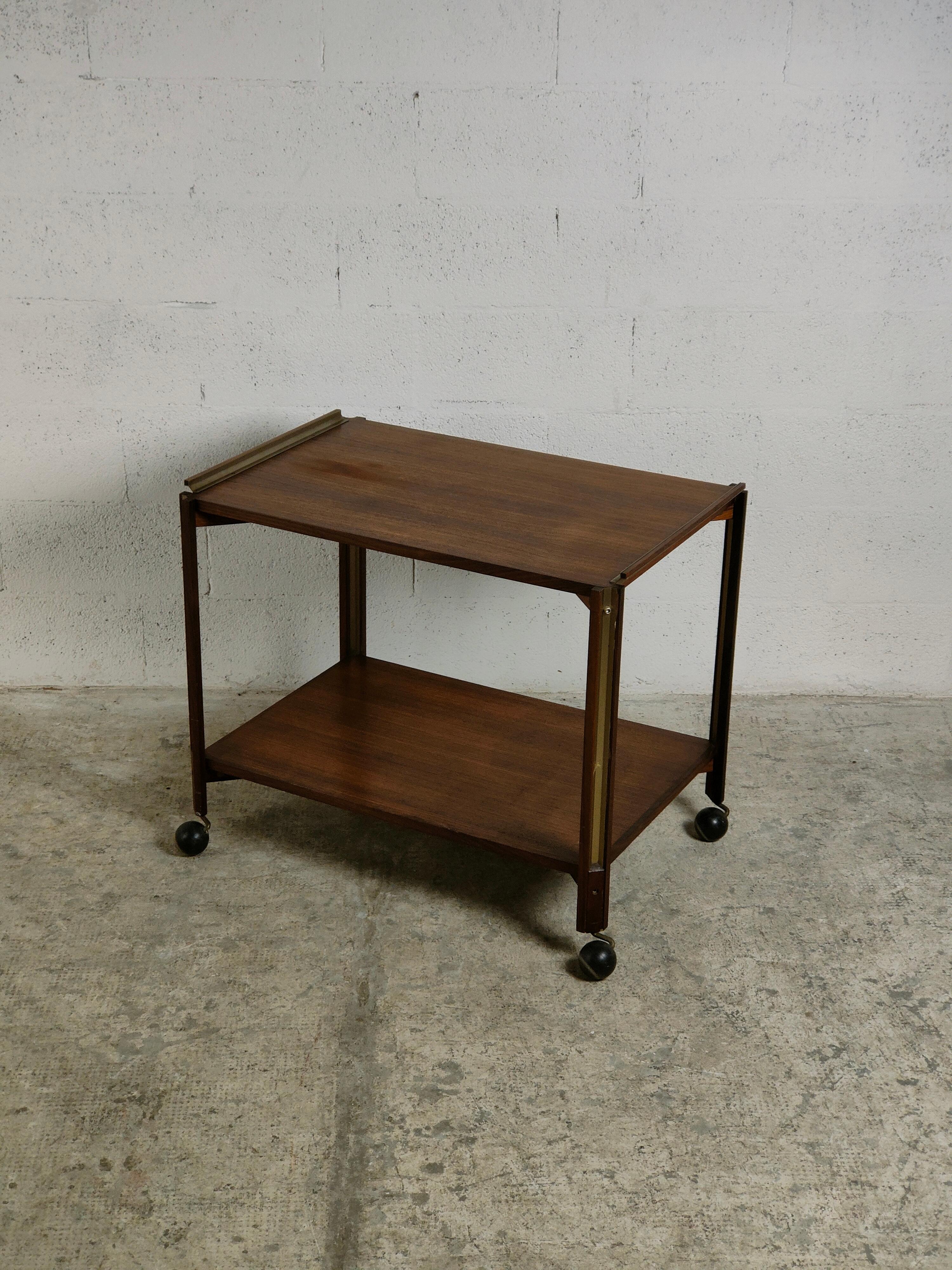 A mix of style refinement and elegance for this two-shelf food trolley designed by Ico Parisi for Stildomous in the 1960s.
Wooden and parts in nickel-plated brass.
Signed under the shelves.
Really good condition.

Domenico Parisi, nicknamed Ico, was