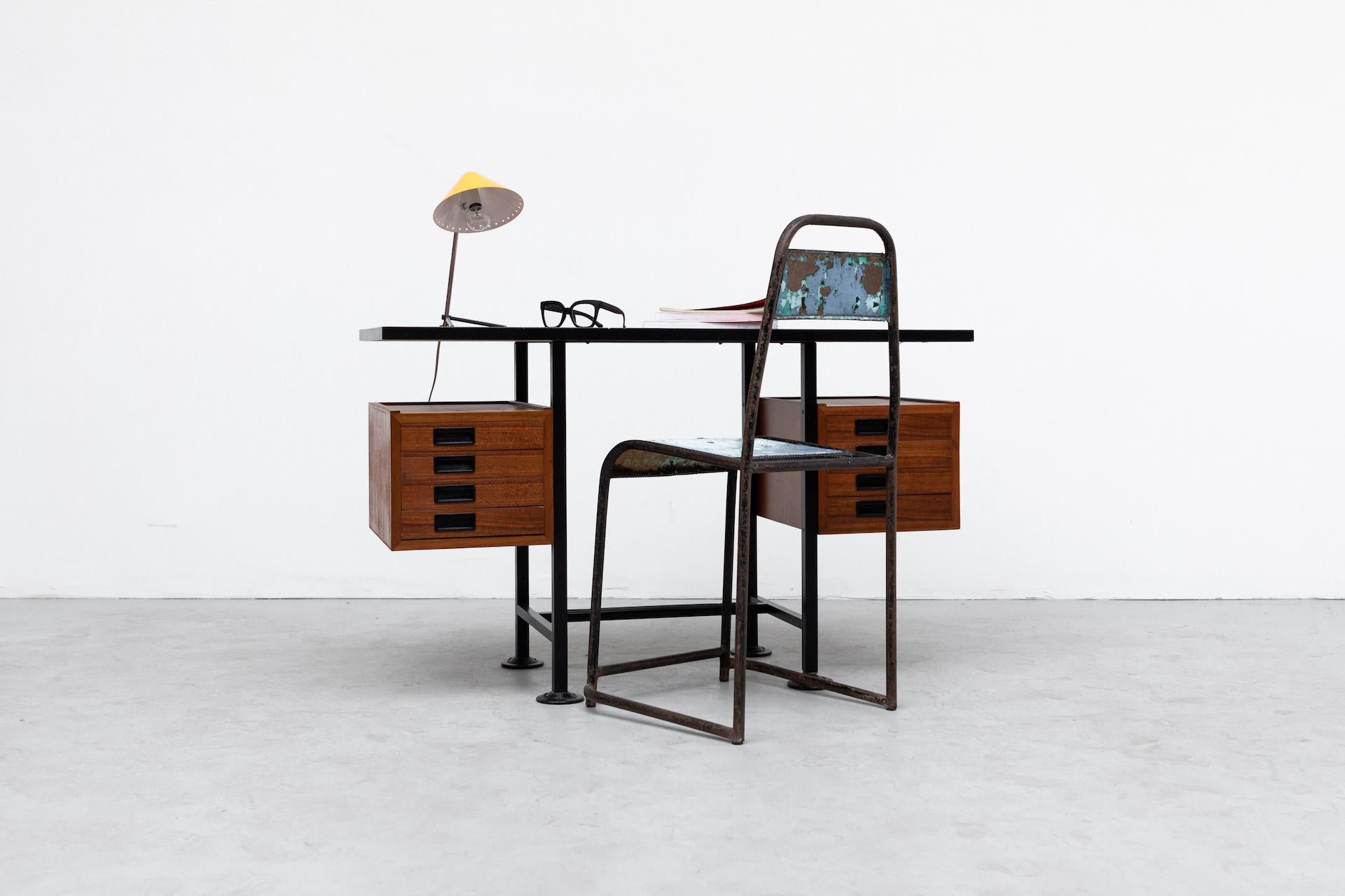 Ico Parisi inspired modernist desk or vanity with floating double stacked drawers and teak top on black enameled metal frame. Lightly refinished wood with original black acrylic inset handles. Wear is Consistent with it's age and use.
