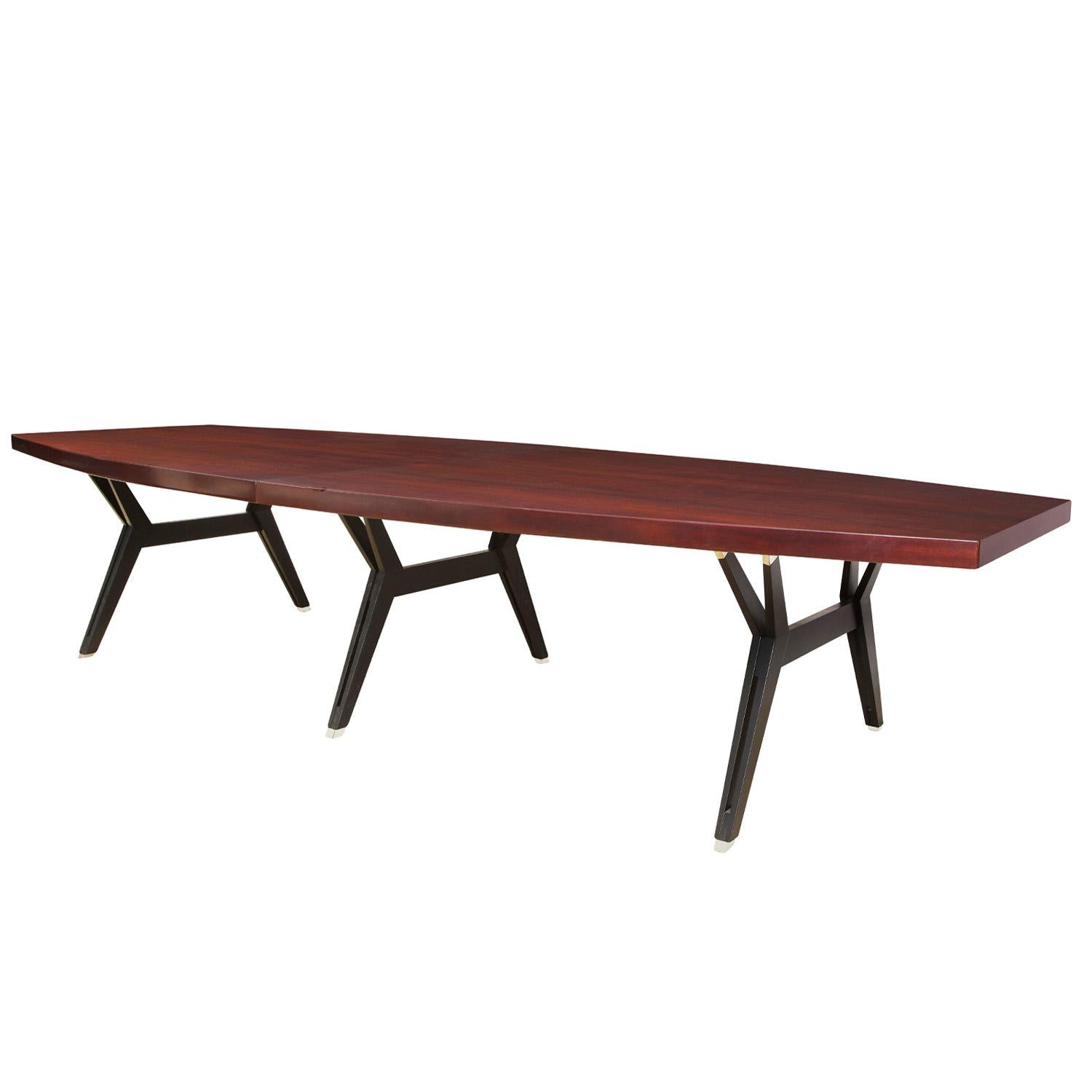 Large impressive bateaux shape dining table with mahogany slab top and sculptural black steel legs with brass sabots by Ico Parisi for M.I.M. Roma, Italy 1950's. This table comes with 2 51 inch leaves so it is monumental when both leaves are