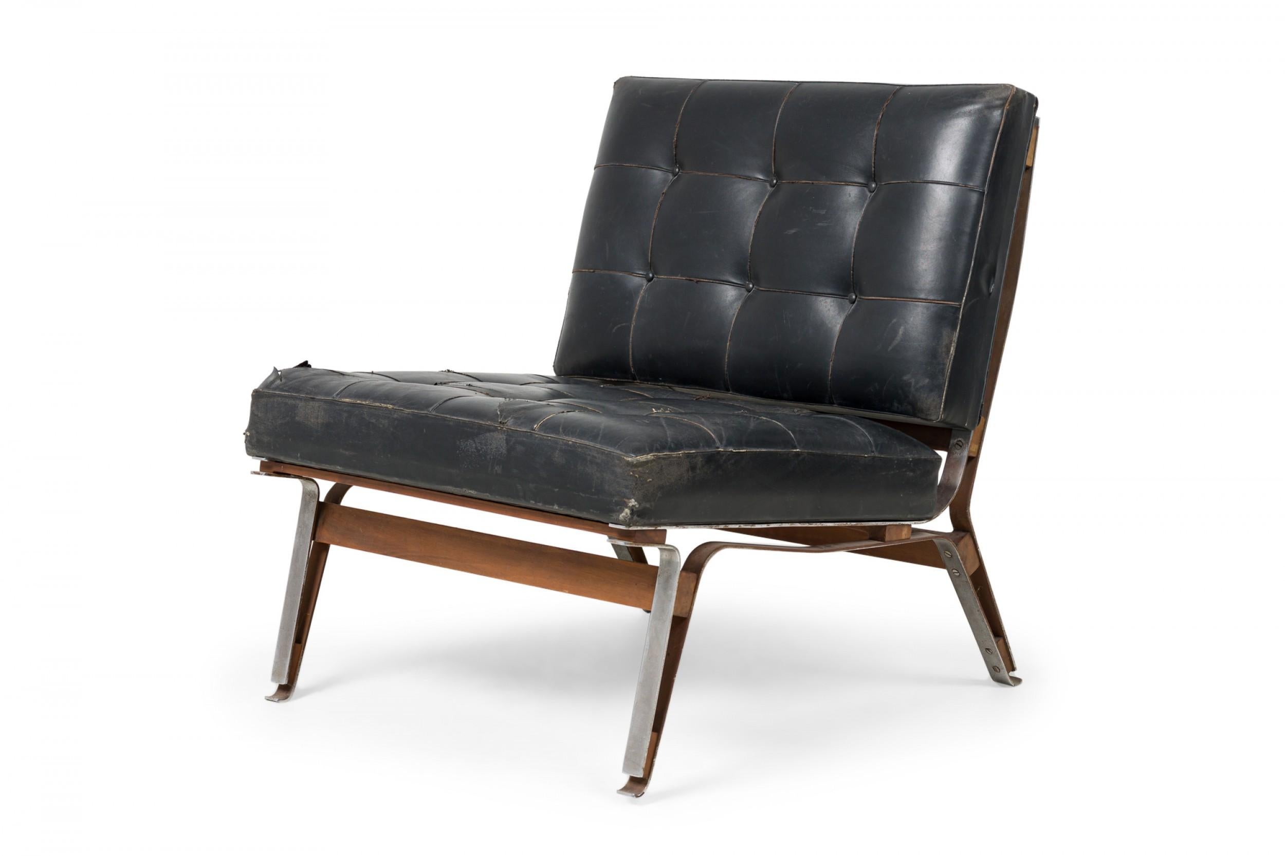 Mid-Century Italian (1950s) slipper chair with a silver metal frame anchored by horizontal wood stretchers and upholstered in button tufted black leather. (ICO PARISI)

Leather is cracking and torn in places along the seat. Corrosion to base