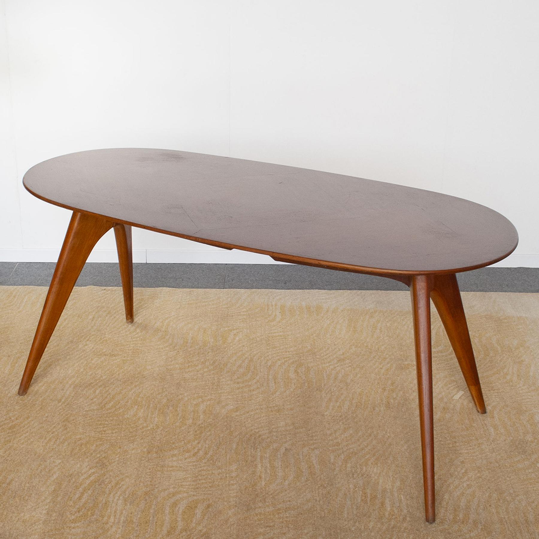 Elegant oval wooden table design ico parisi 60s produced by Fratelli Rizzi.